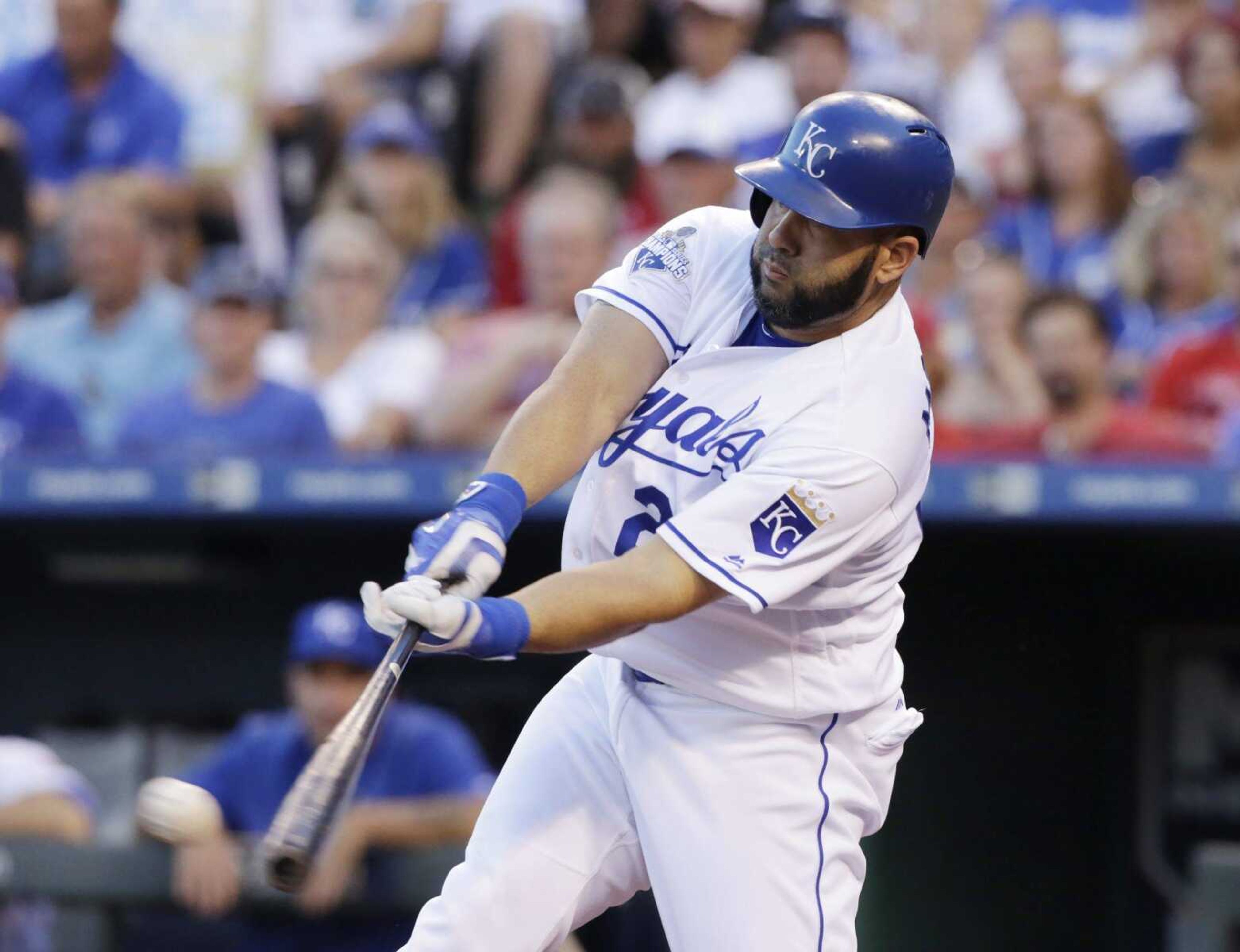 Kansas City Royals designated hitter Kendrys Morales hits a single for two RBI's in the first inning of a baseball game against the St. Louis Cardinals in Kansas City, Mo., Monday, June 27, 2016. (AP Photo/Colin E. Braley)