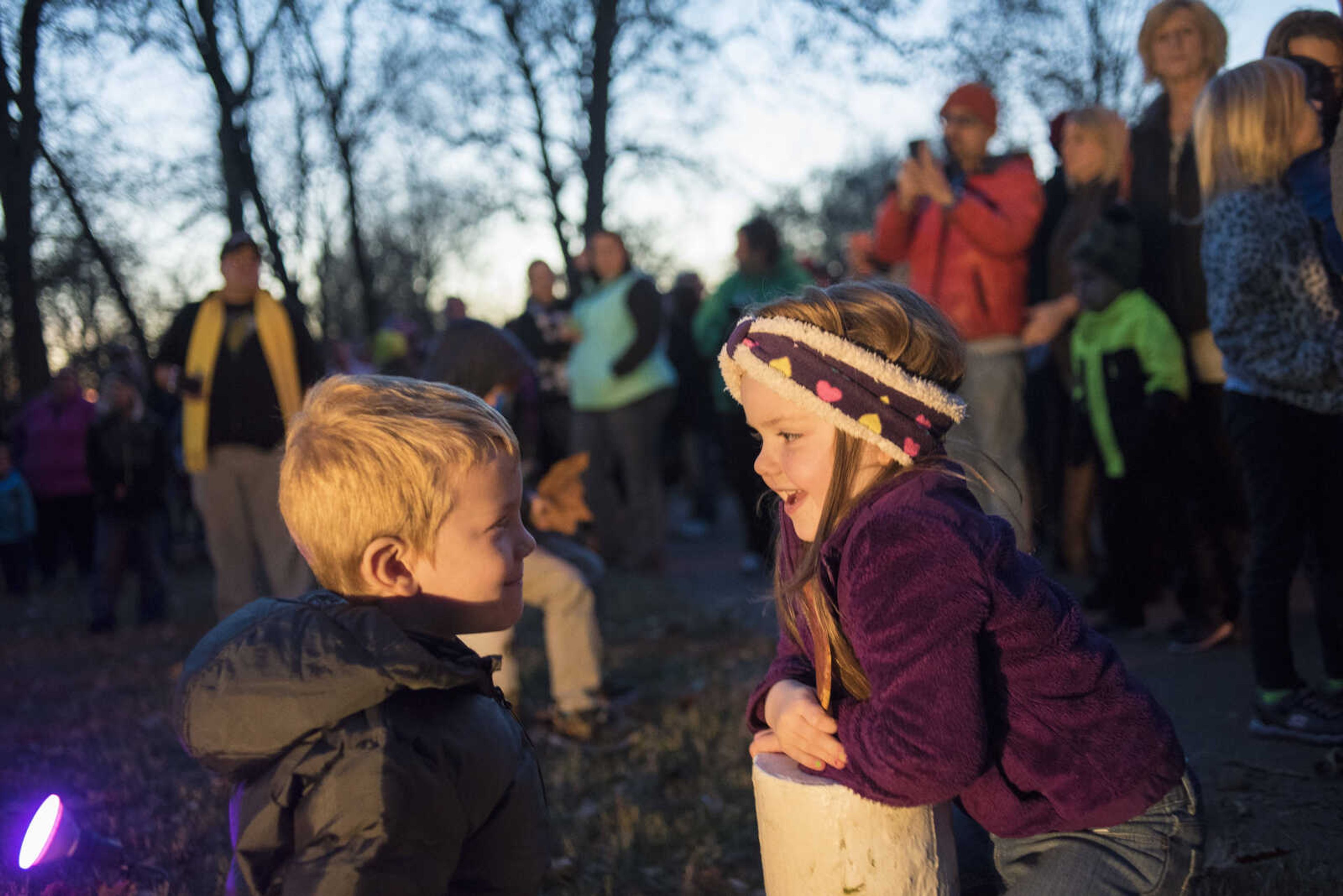 Trent Lange, 6, and his cousin Molly Becker, 5, wait for the the lights to be turned on during the Jackson Holiday Extravaganza Friday, Nov. 24, 2017 at the Jackson City Park.