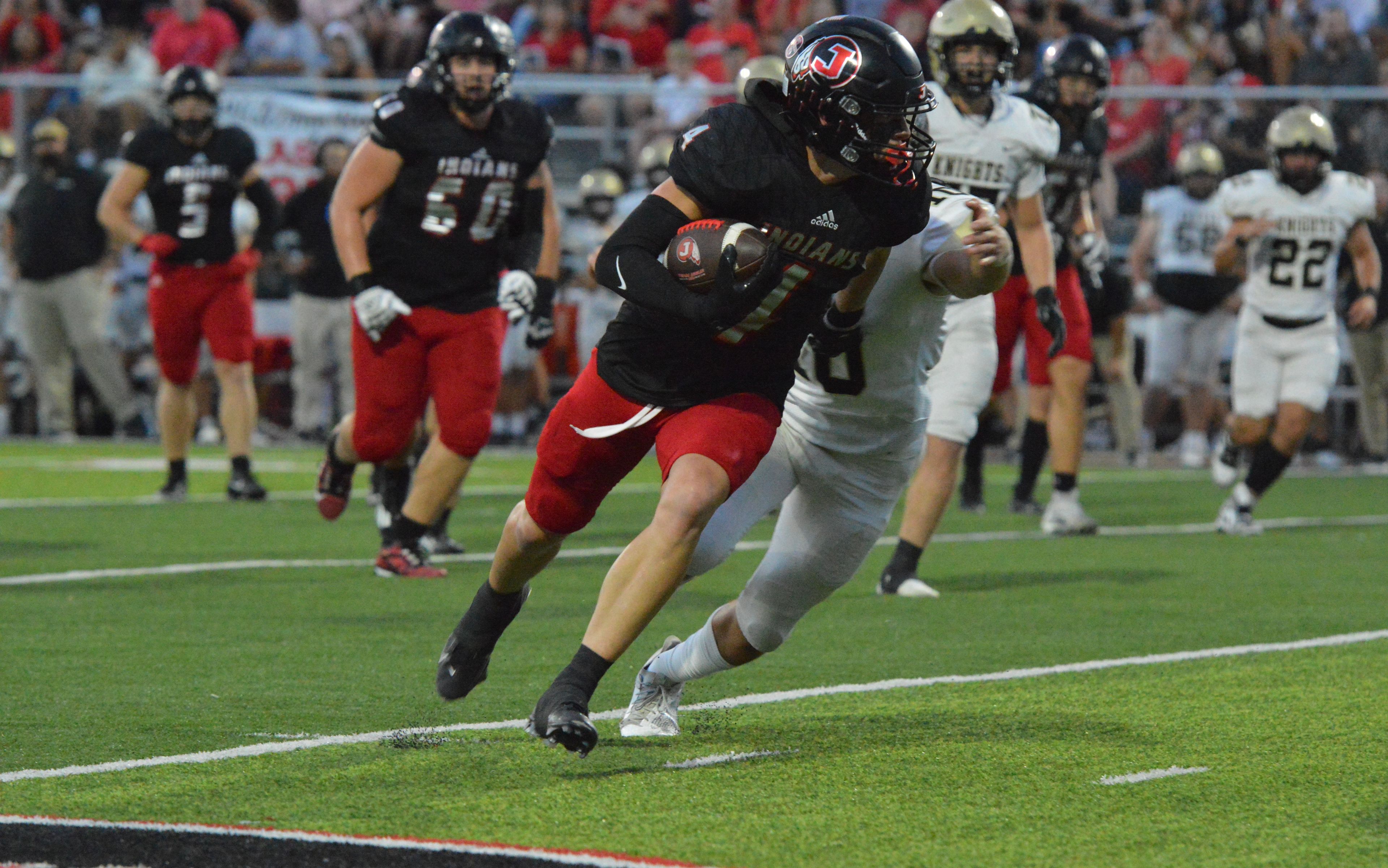 Jackson senior wide receiver Kai Crowe cuts it up field against Farmington on Friday, Sept. 20.