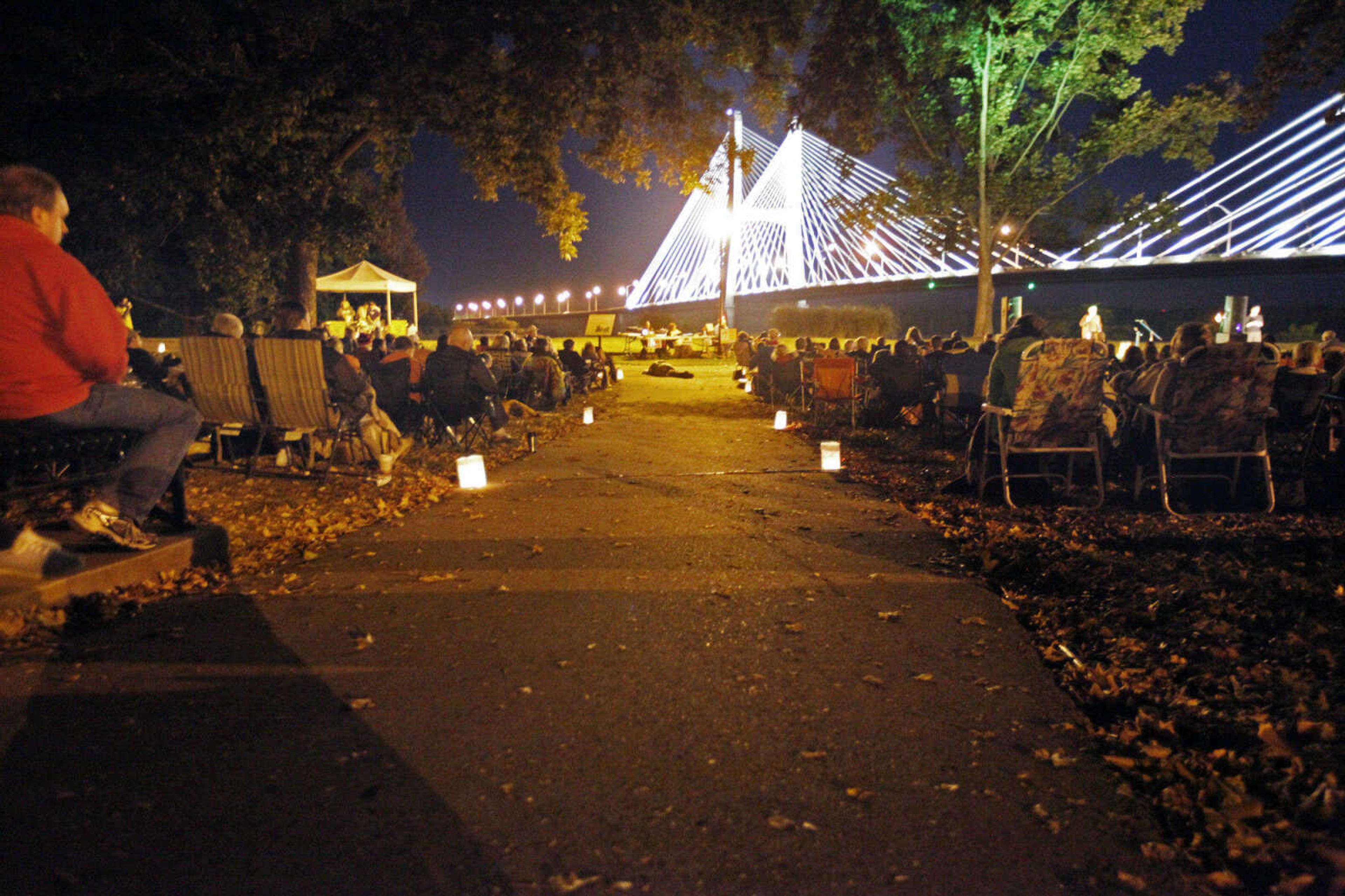 CHRIS MACKLER ~ photos@semissourian.com

Audience members enjoy the tales of Grammy-award-winning songwriter Michael Harrell during the Ghost Storytelling Festival held near the Old Beech Tree on the east lawn of Southeast Missouri State University's River Campus in Cape Girardeau on Friday, Oct. 15, 2010. According to Chuck Martin, Executive Director of the Cape Girardeau Convention and Visitors Bureau, around 650 people attended the event.