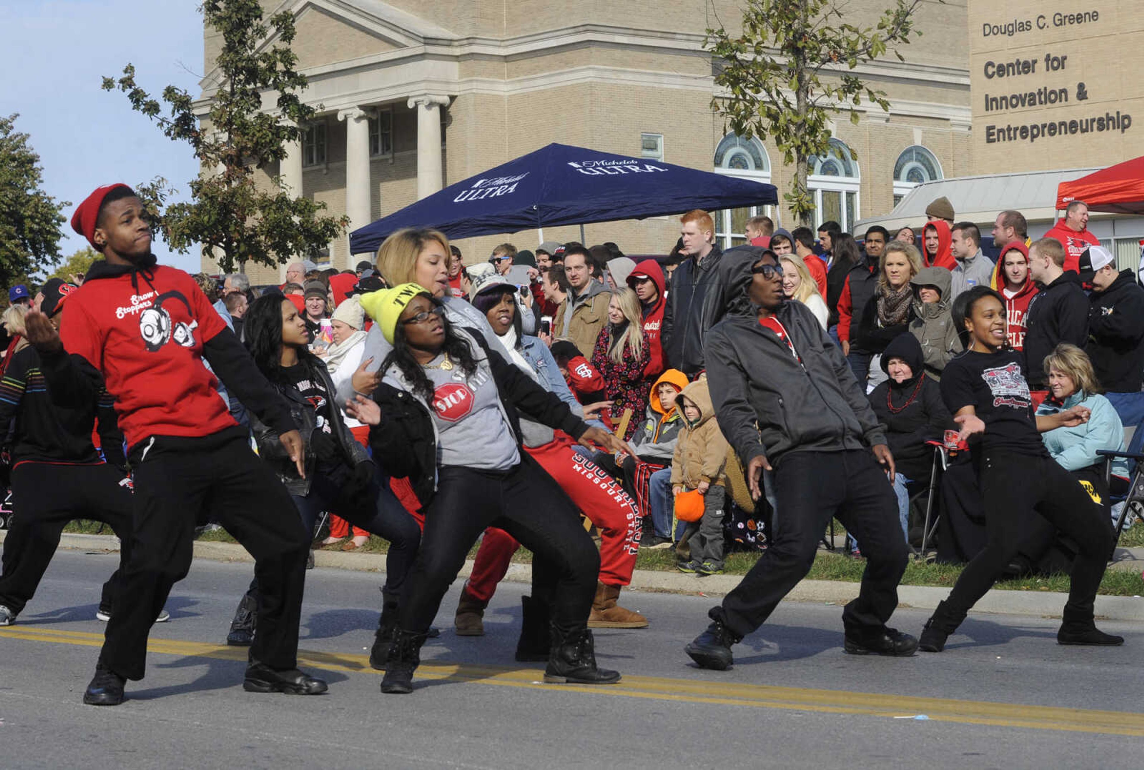 Members of the SEMO Show Stoppers dance team perform in the SEMO Homecoming parade Saturday, Oct. 26, 2013 on Broadway in Cape Girardeau.