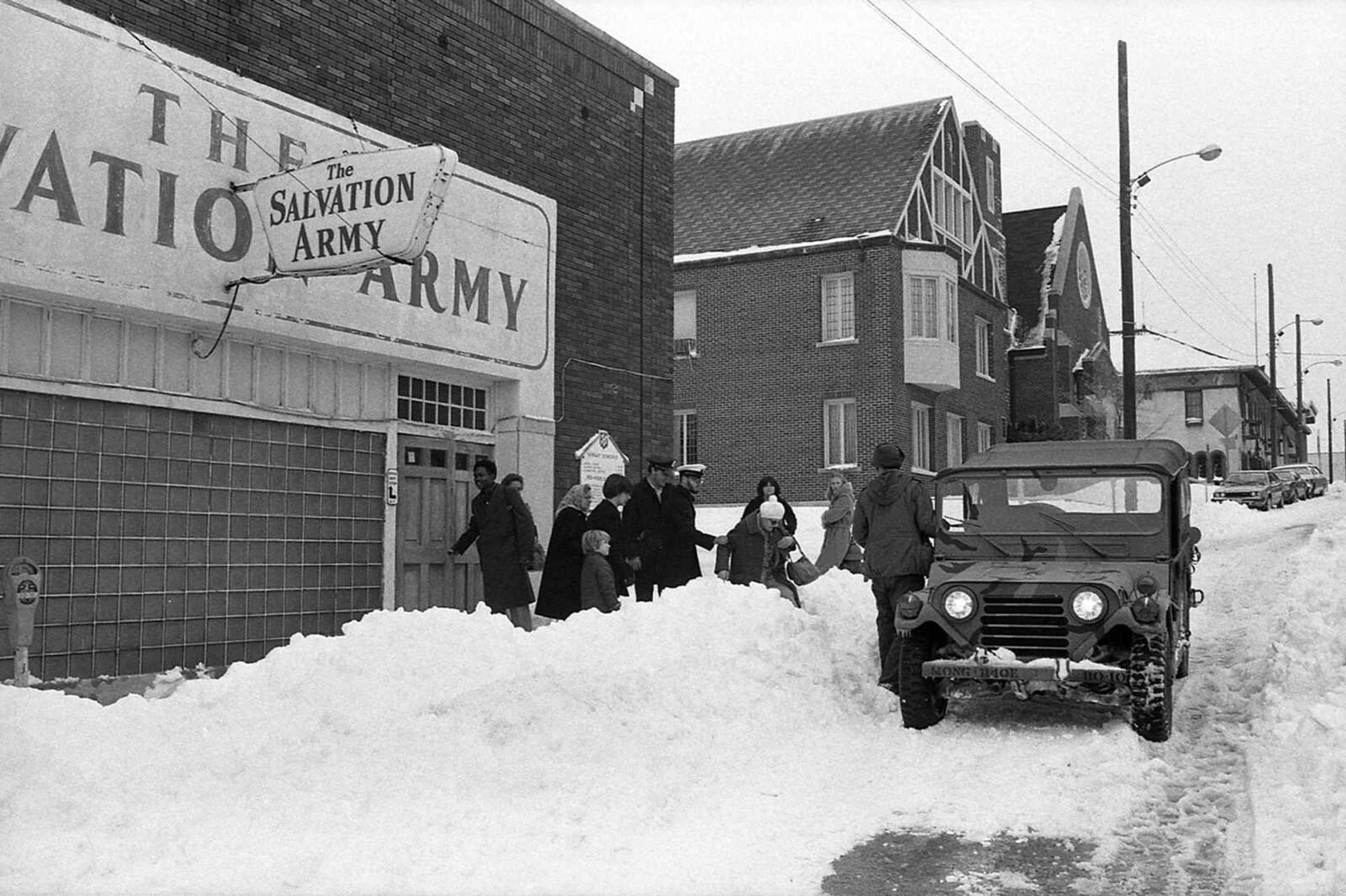 The driver of a Greyhound bus and his five passengers, who rode out the Blizzard of '79 in the bus after it stalled at U.S. 61 and Route W, were loaded onto a National Guard Jeep for a return to the bus, after spending a night at the Salvation Army office on Broadway. (Southeast Missourian archive photo by Fred Lynch)