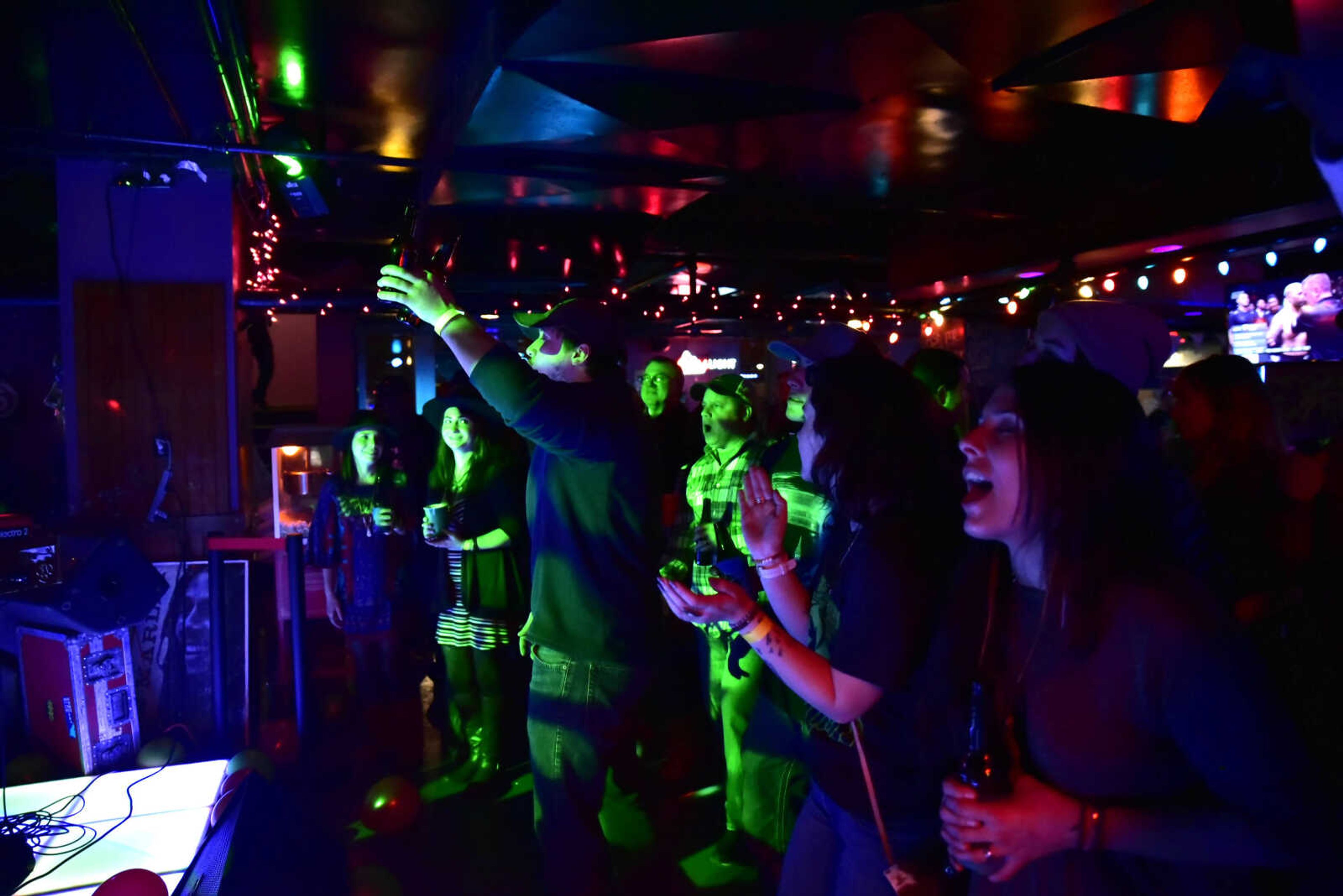 Patrons fill the floor and sing along as Natty Nation performs covers of Bob Marley songs at the 3rd annual Bob Marley Day celebration held at Ragsdales in downtown Cape Girardeau Feb. 10, 2018.