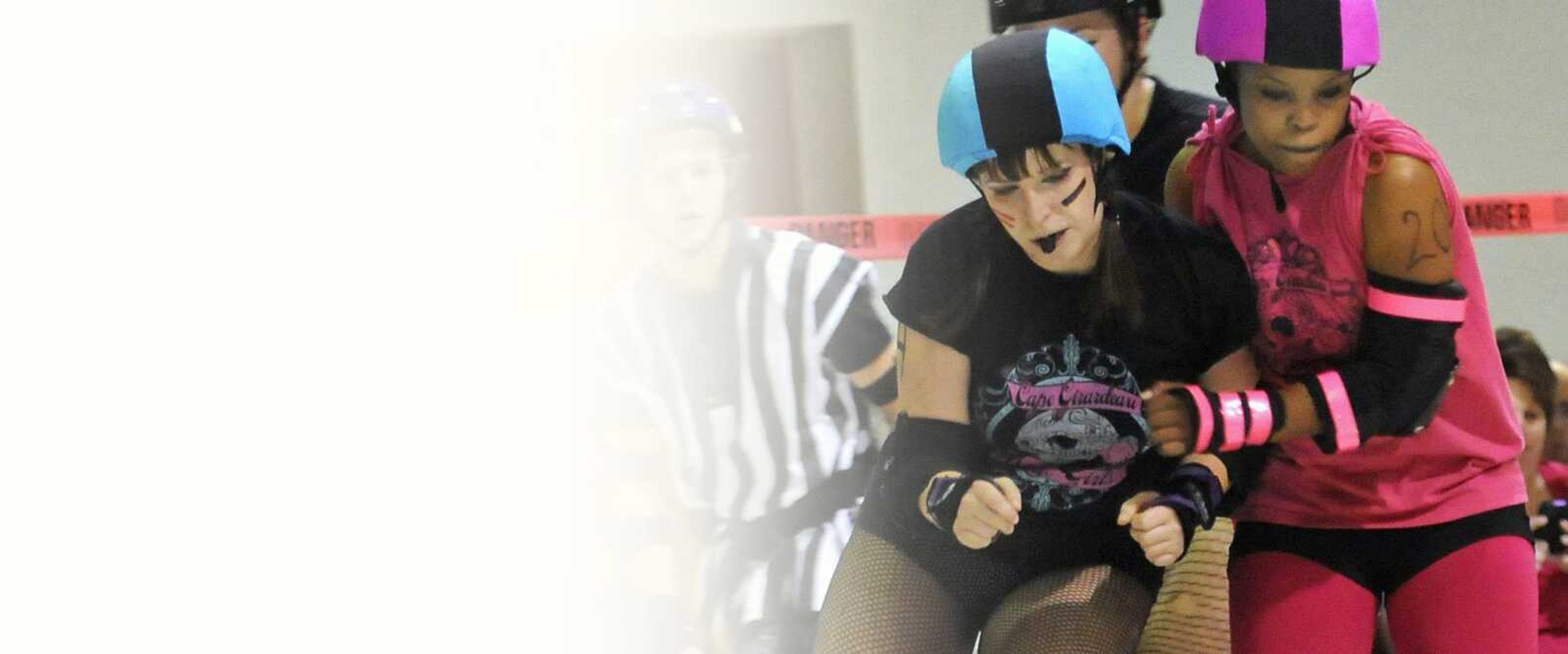 The Broadway Brawlers' Groovie Ghoulie, left, and the Mississippi Mavens' Laryn Kill, right, body check each other during the Capetown Smackdown, the Cape Girardeau Roller Girls' inaugural intraleague scrimmage at the A.C. Brase Arena Building on Friday, Nov. 12, 2010. The Mississippi Mavens defeated the Broadway Brawlers 76-74. (Kristin Eberts)