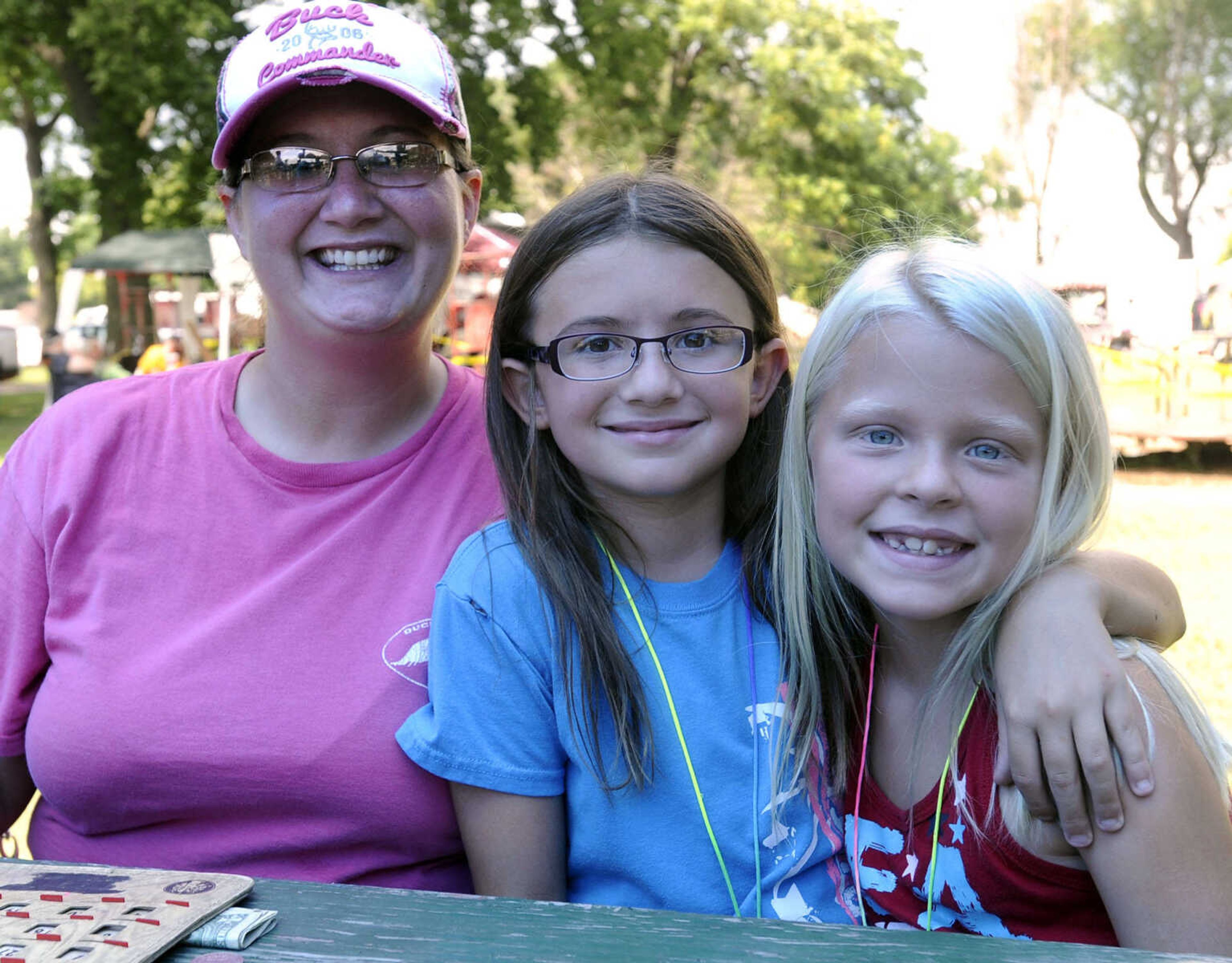 Terri Rains, left, Hailey Rains and Gracelynn Stidham pose for a photo at German Days on Saturday, Aug. 9, 2014 at Frisco Park in Chaffee, Missouri.