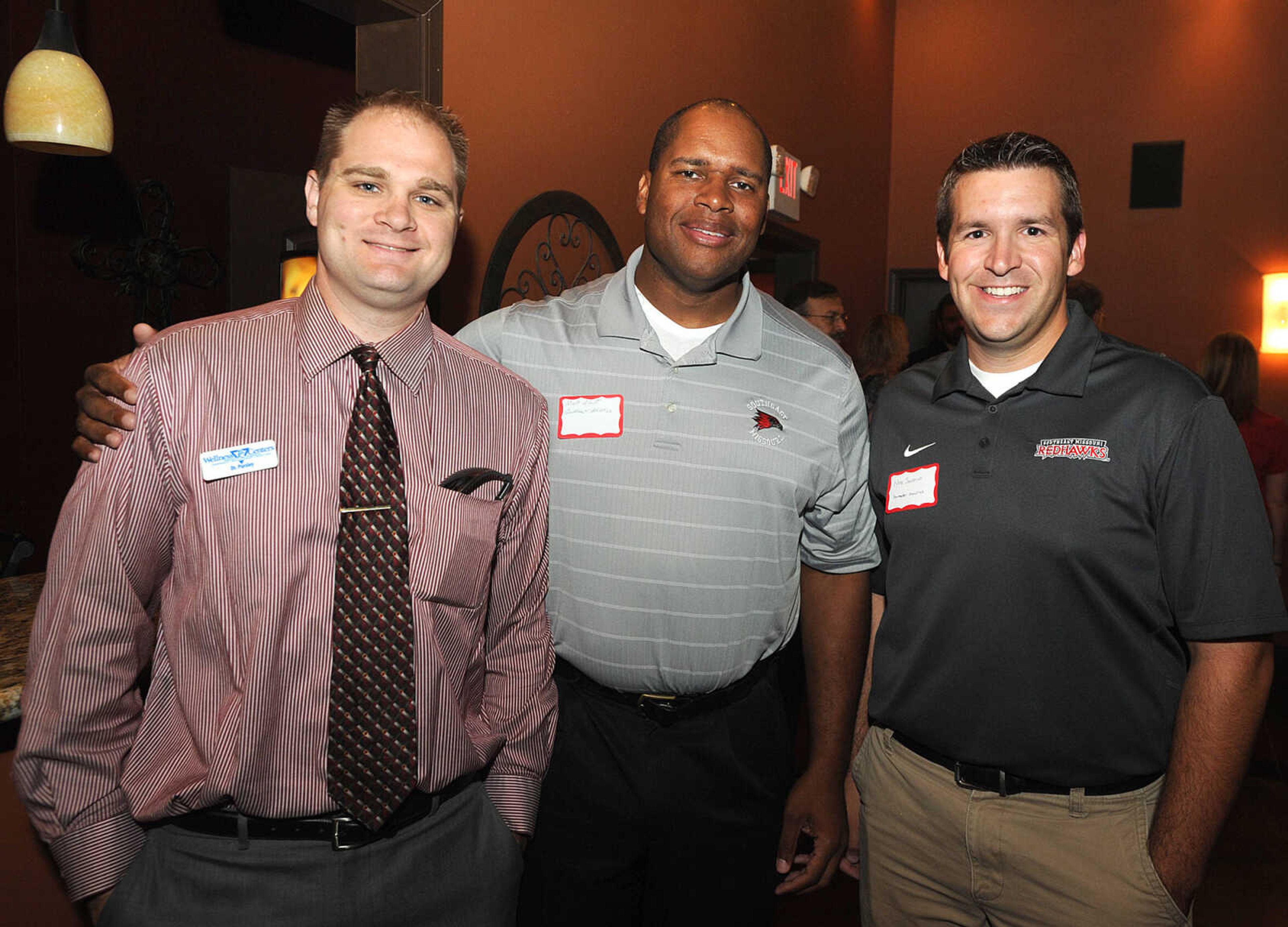 Dr. Gregory Pursley with PC Wellness Centers, left, Mark Alnutt and Nate Saverino with Southeast Missouri State University Athletics.