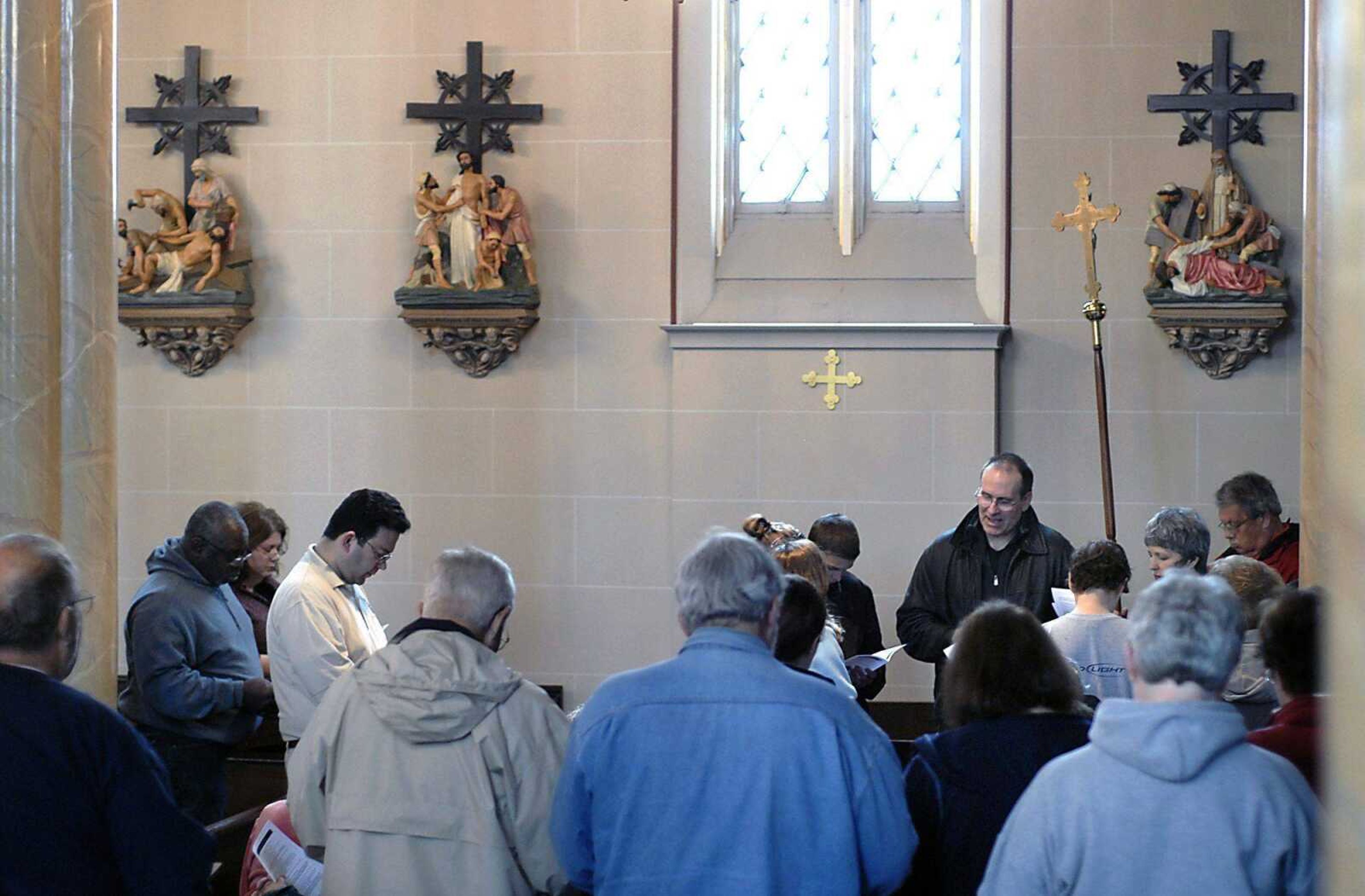 The Way of the Cross, an annual ecumenical service sponsored by the Downtown Council of Churches, takes place inside of Old St. Vincent's Catholic Church Friday, April 10, 2009, in Cape Girardeau due to inclement weather.  Over 70 people participated in the event, which normally moves around town with different stops coordinating with the Stations of the Cross. (KIT DOYLE ~ kdoyle@semissourian.com)