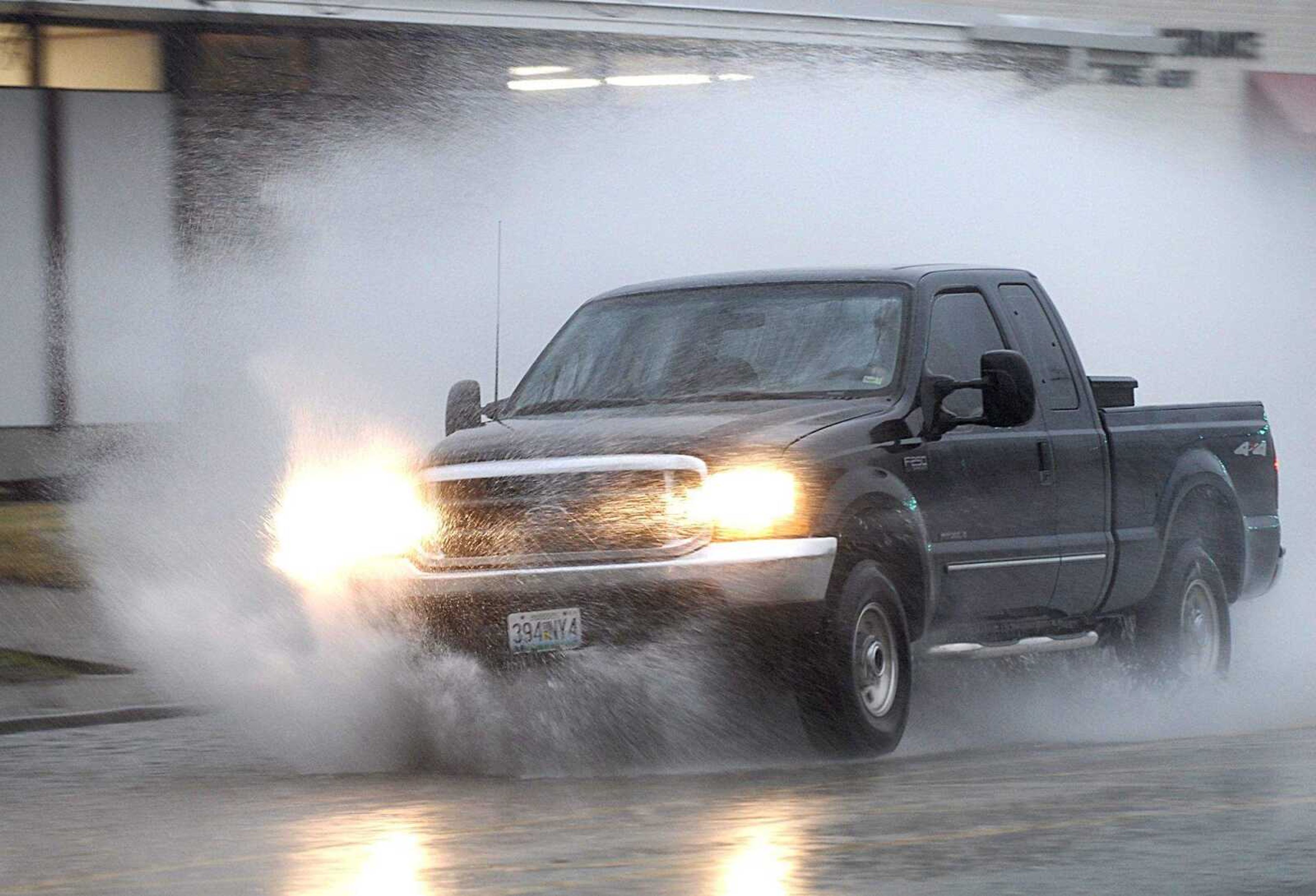 AARON EISENHAUER ~ aeisenhauer@semissourian.com
A truck blazes through the standing water on Broadway near the intersection with Caruthers on Tuesday, March 18, 2008.