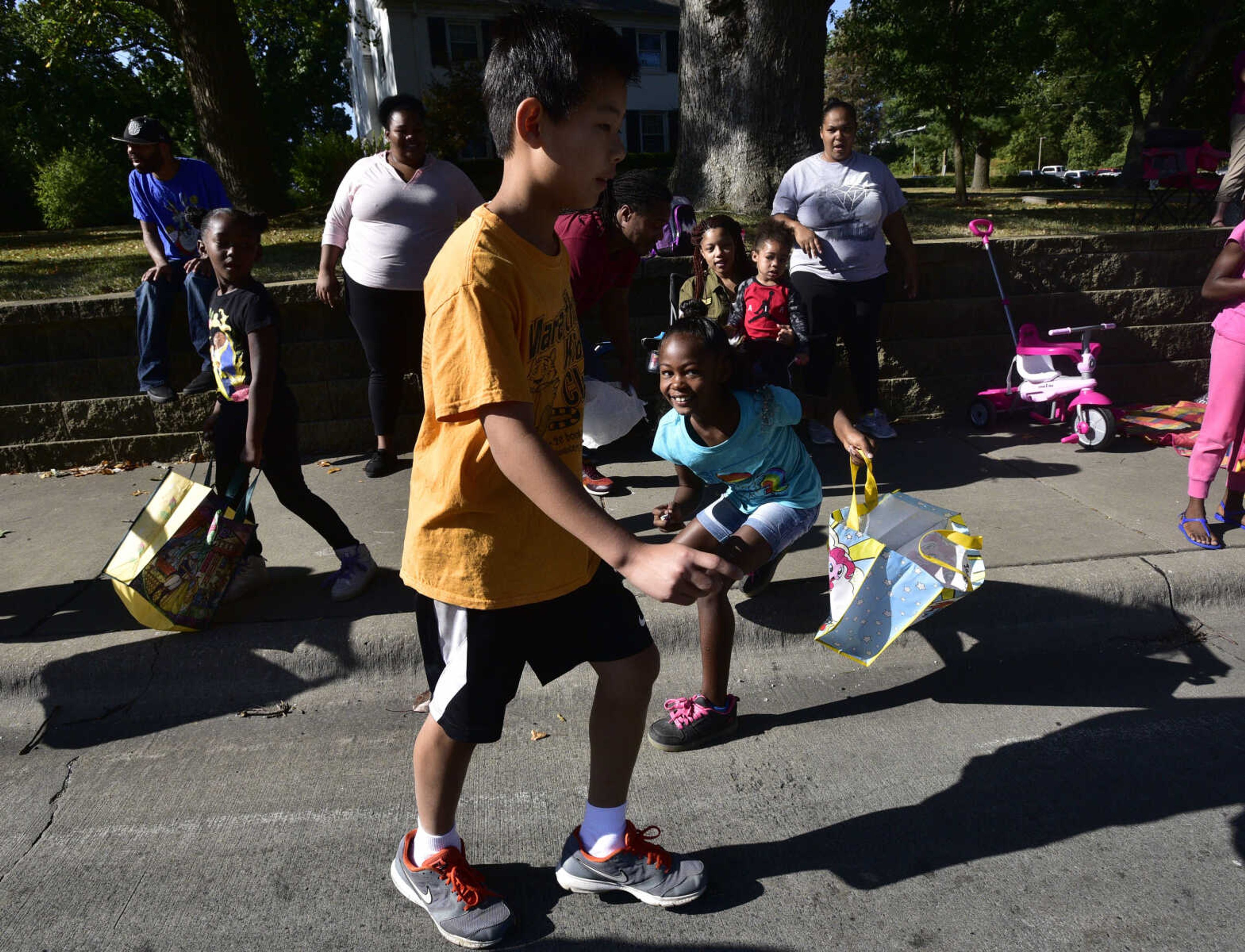 Kids hunt for candy during the SEMO District Fair parade Saturday, Sept. 9, 2017 in Cape Girardeau.