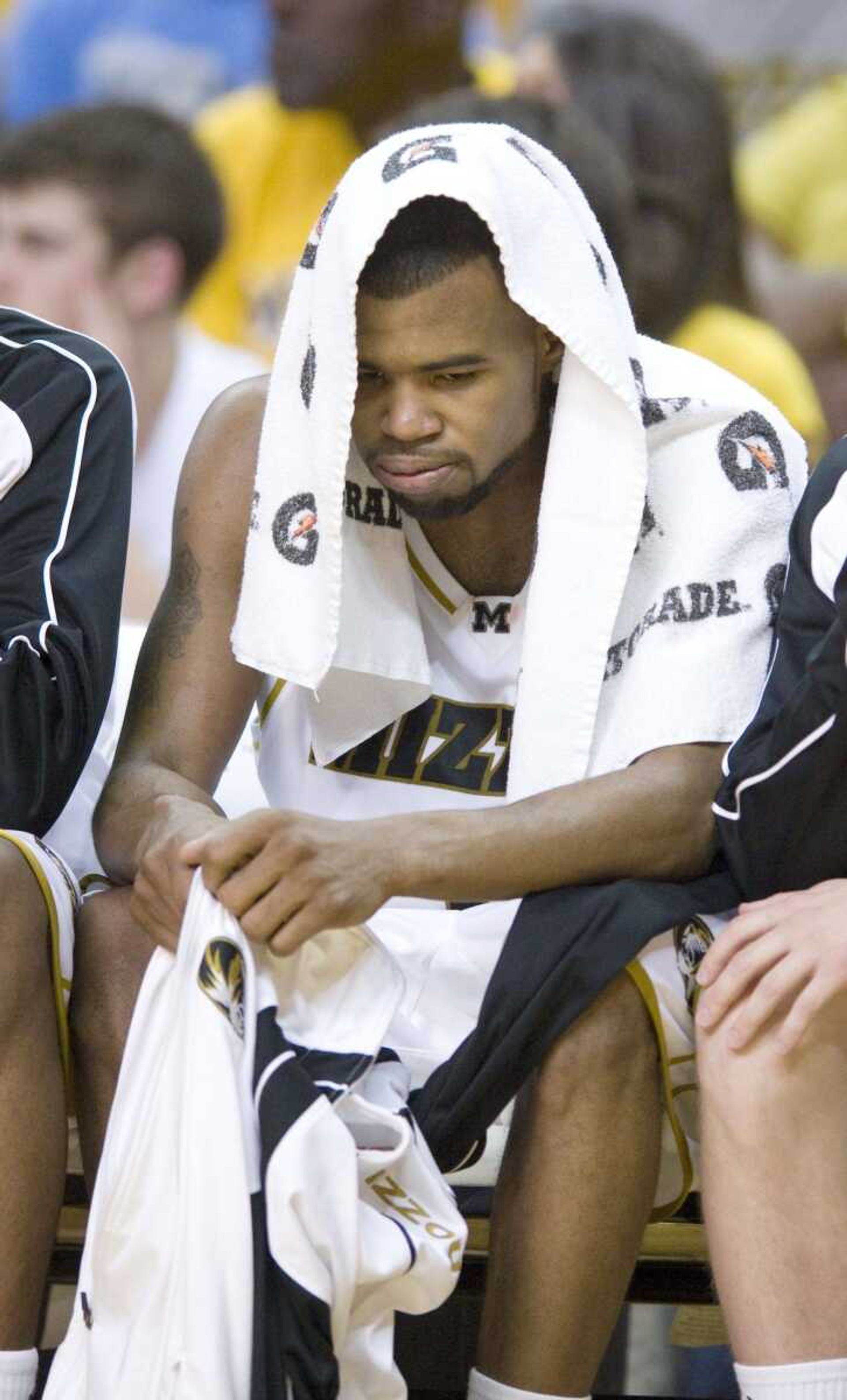 Missouri senior Zaire Taylor bows his head as he sits on the bench late in the game Saturday against Kansas in Columbia, Mo. It was Taylor's final home game at Missouri.