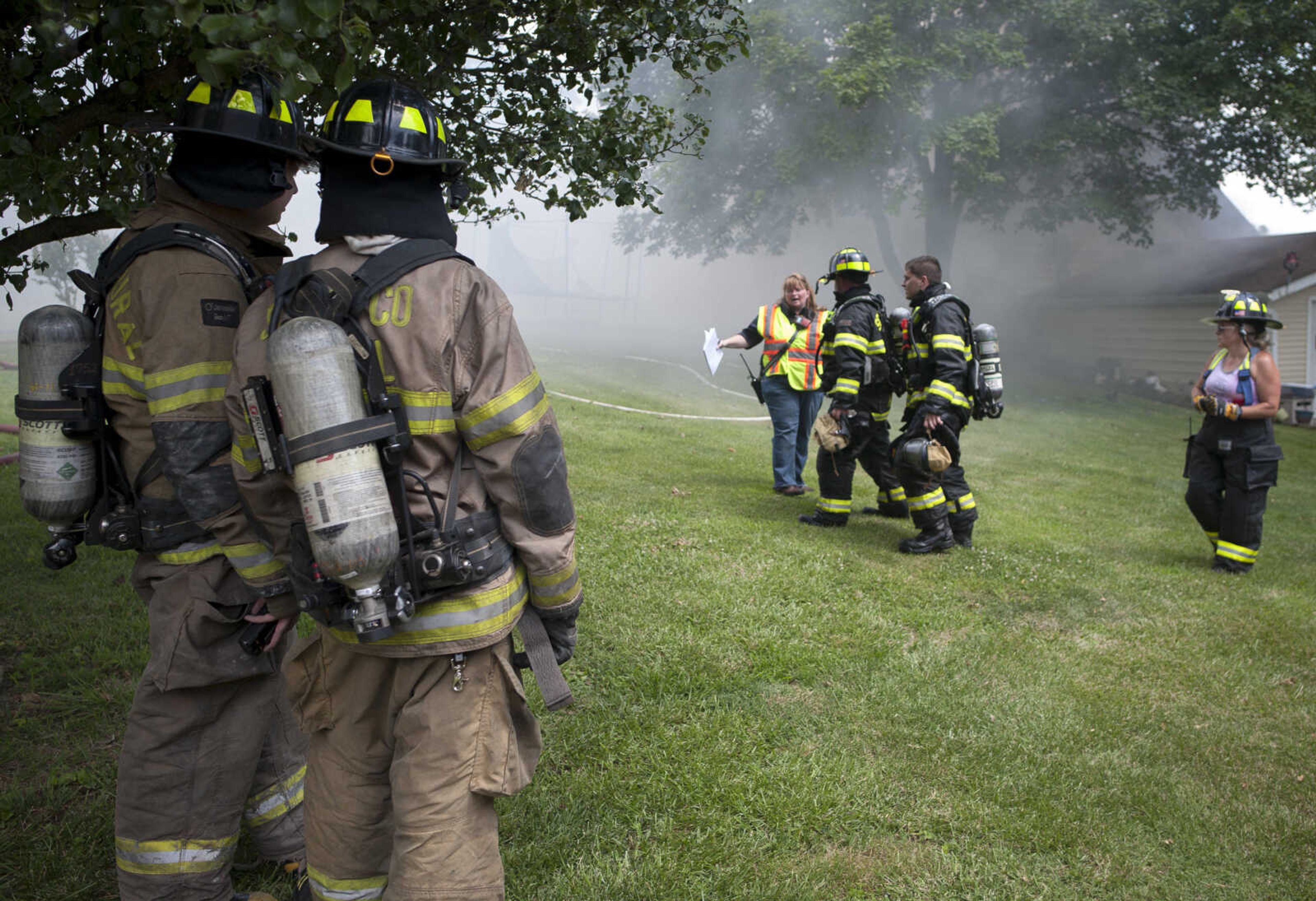 Members of the NBC Fire Protection District receive mutual aid from the Oran Fire Protection District, the Scott City Fire Department, the Scott County Rural Fire Protection District and the Scott County Sheriff's Office during a working fire Thursday, June 25, 2020, in the 300 block of Lake Road in Scott County between U.S. Highway 61 and Interstate 55.