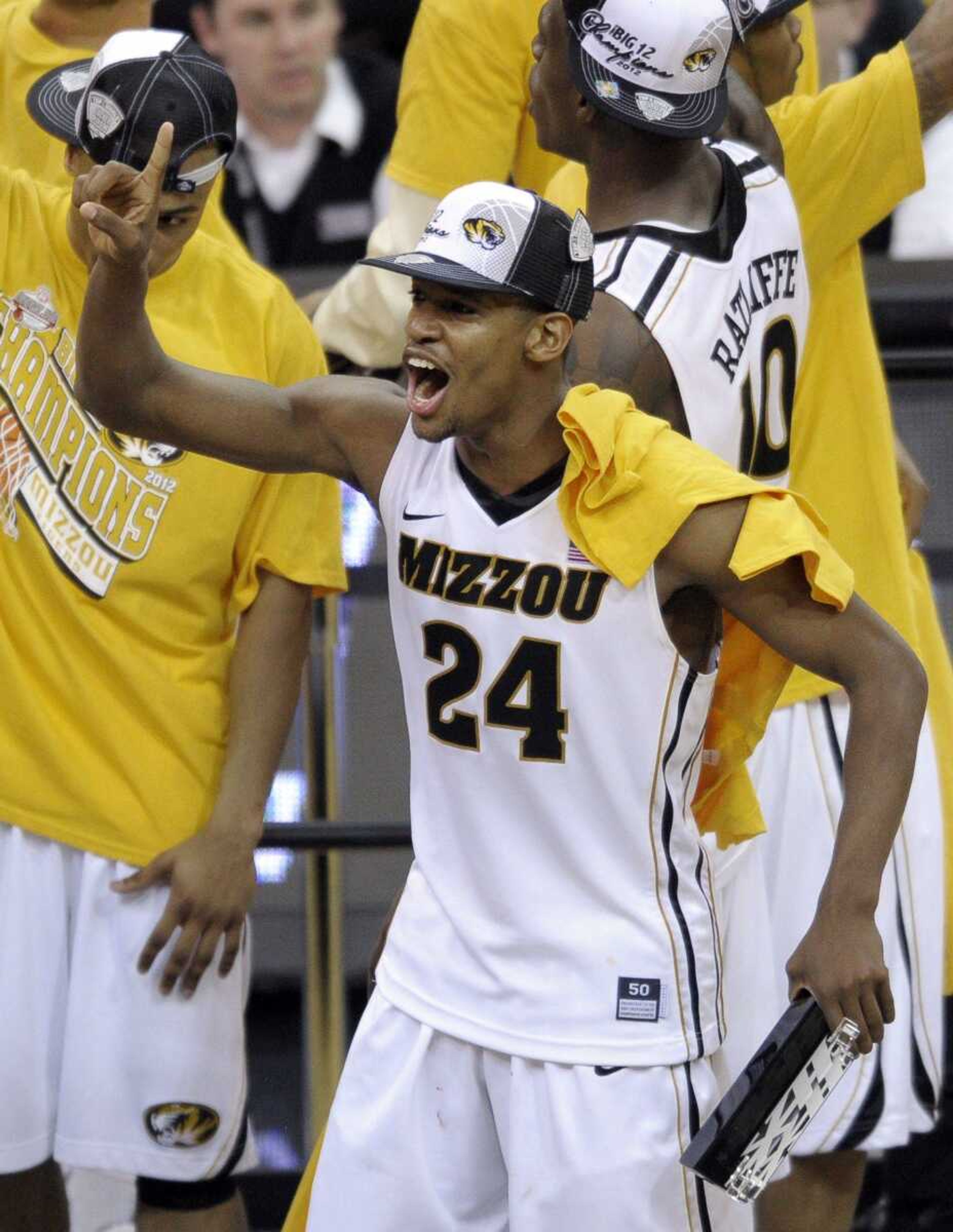 Missouri guard Kim English celebrates Saturday after the Tigers won the Big 12 Conference tournament in Kansas City, Mo. (REED HOFFMANN ~ Associated Press)