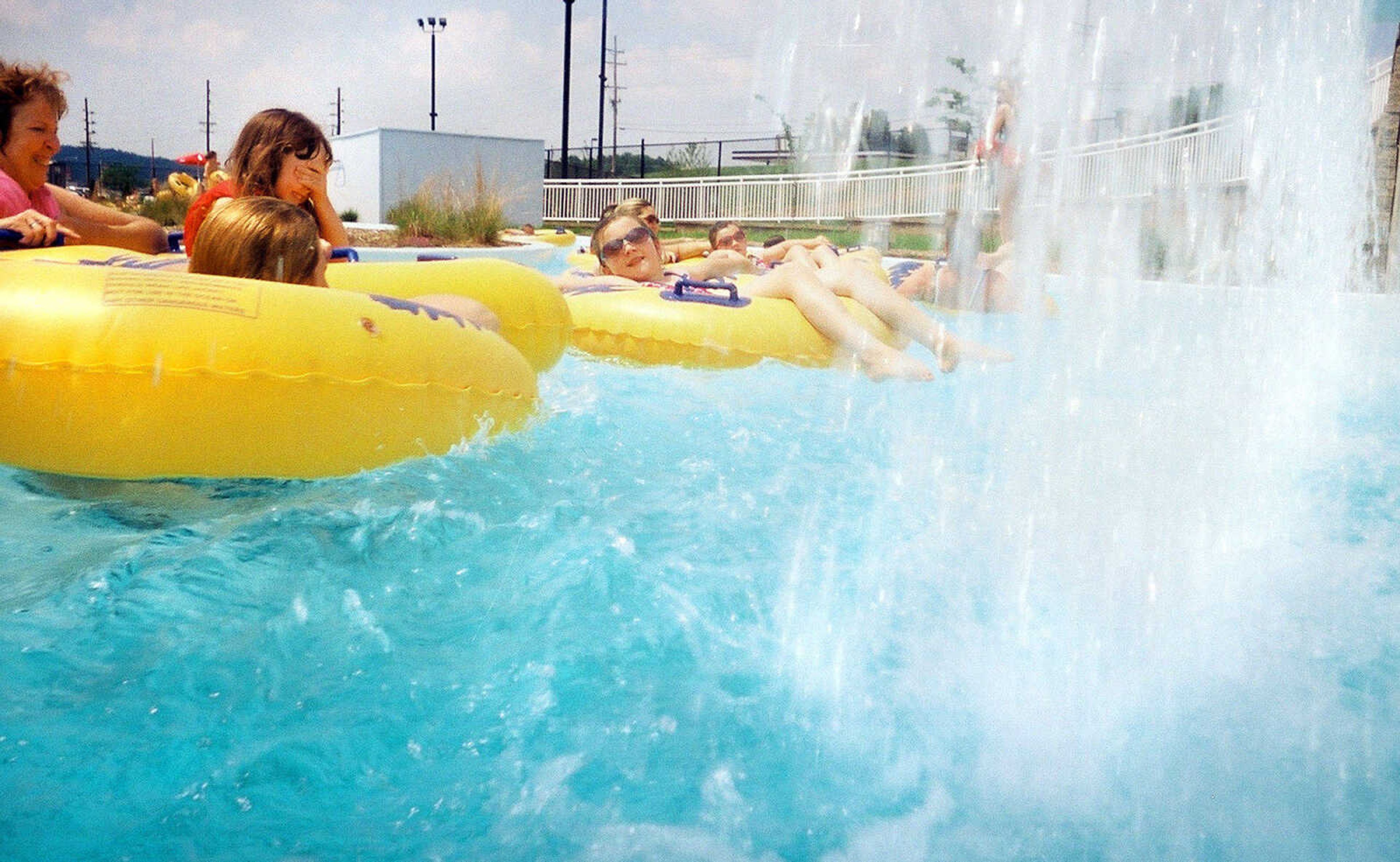 LAURA SIMON~lsimon@semissourian.com
Visitors of Cape Splash Family Auquatic Center float past the waterfall along the lazy river Saturday, May 29, 2010.