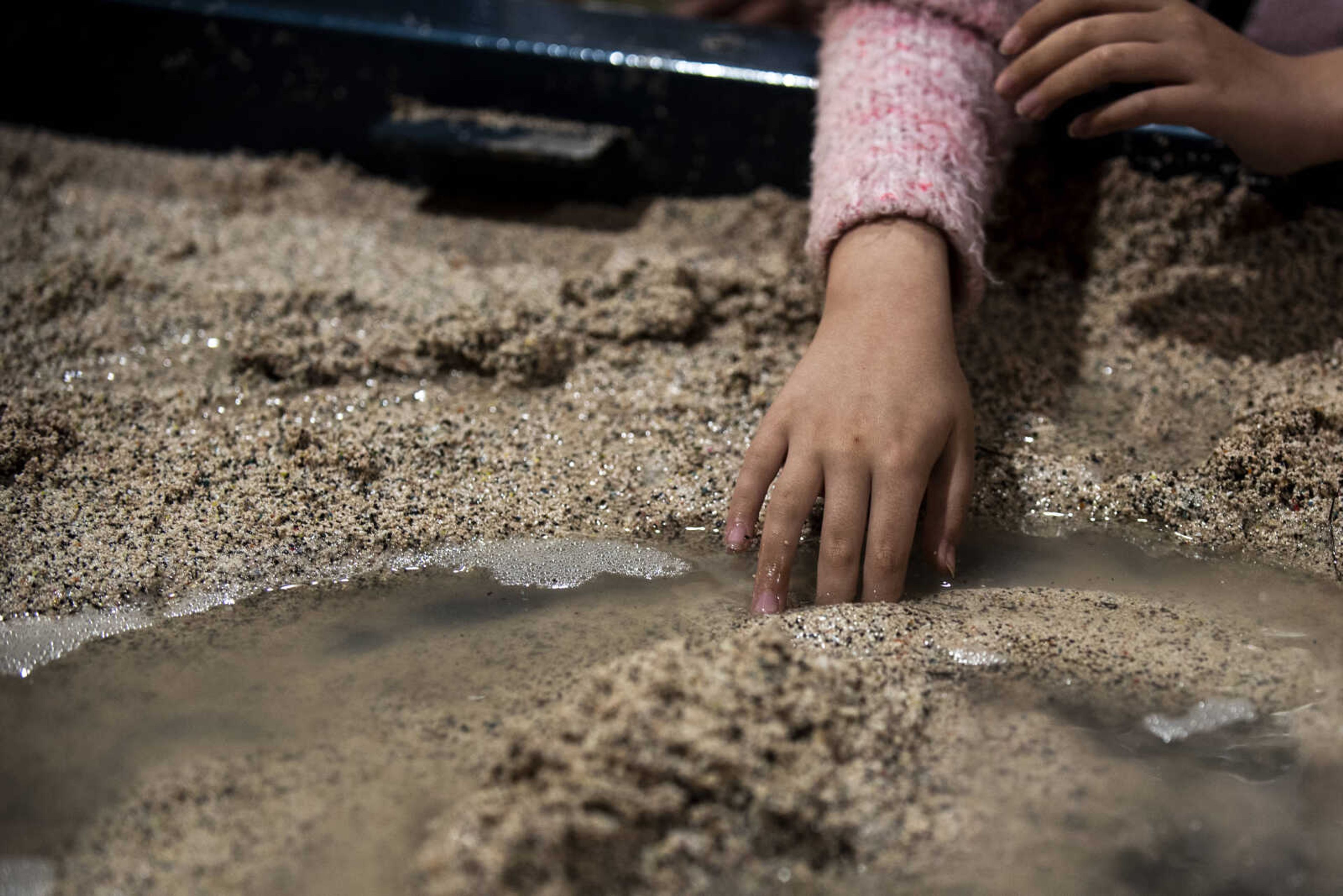 A second grade student from Perryville touches the water in the stream table during a presentation at the 24th annual Farm Day sponsored by the Southeast Missouri Cattlemen's Association at Flickerwood Arena Wednesday, April 24, 2019, in Jackson. Over 800 students attended Farm Day and learned about a variety of farm-related topics from forestry to soil conservation, as well as farm animals and honey bees.