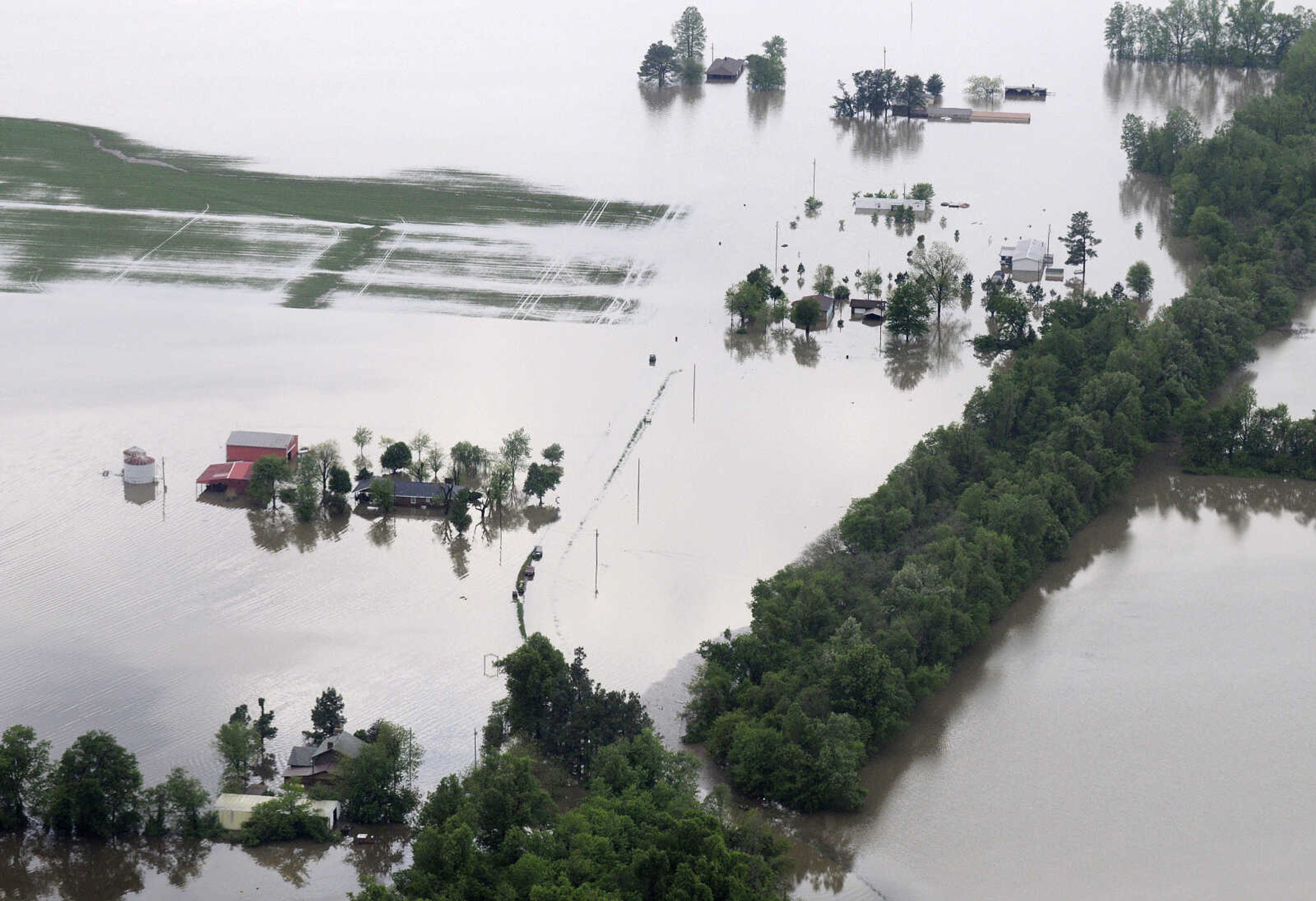 KRISTIN EBERTS ~ keberts@semissourian.com

Houses are buried in floodwater in southern Illinois, south of Horseshoe Lake, on Tuesday, May 3, 2011.