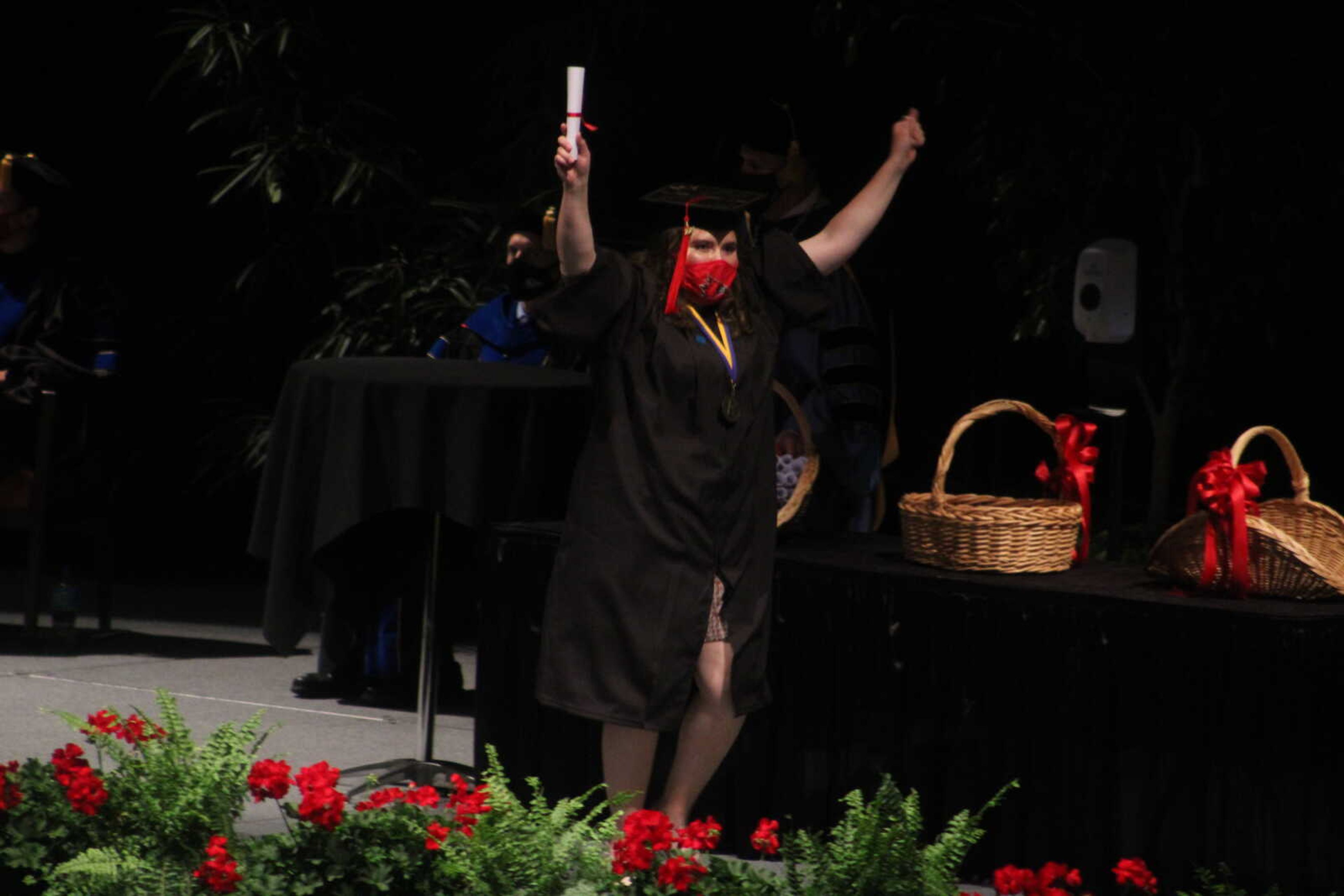 A Southeast graduate cheers after receiving her diploma during the 6 
p.m. spring commencement ceremony held on Saturday, May 15, 2021, at the
 Show Me Center in Cape Girardeau.