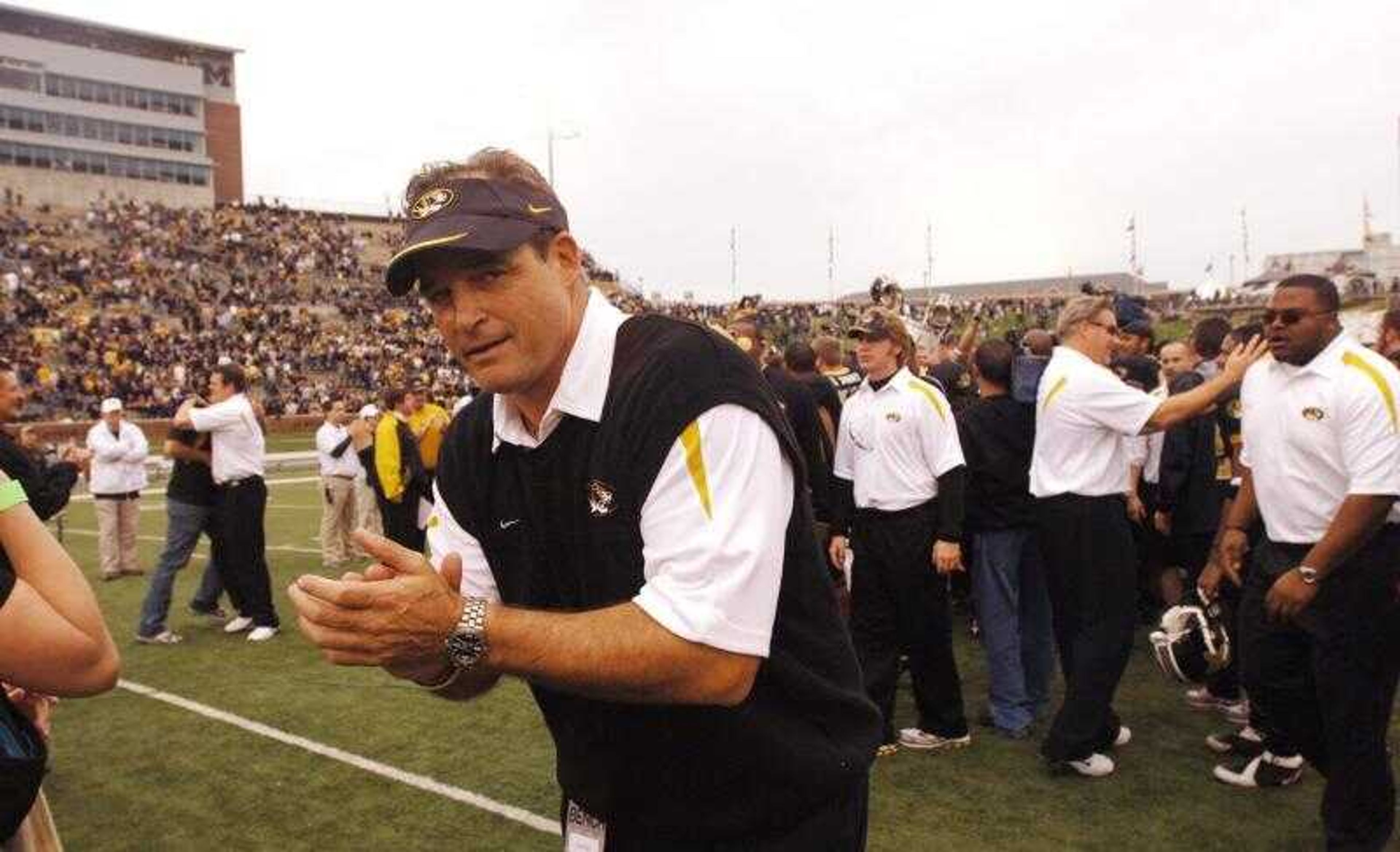 Missouri coach Gary Pinkel clapped his hands as he ran off the field after Saturday's 42-17 victory over Kansas in Columbia, Mo. (L.G. PATTERSON ~ Associated Press)