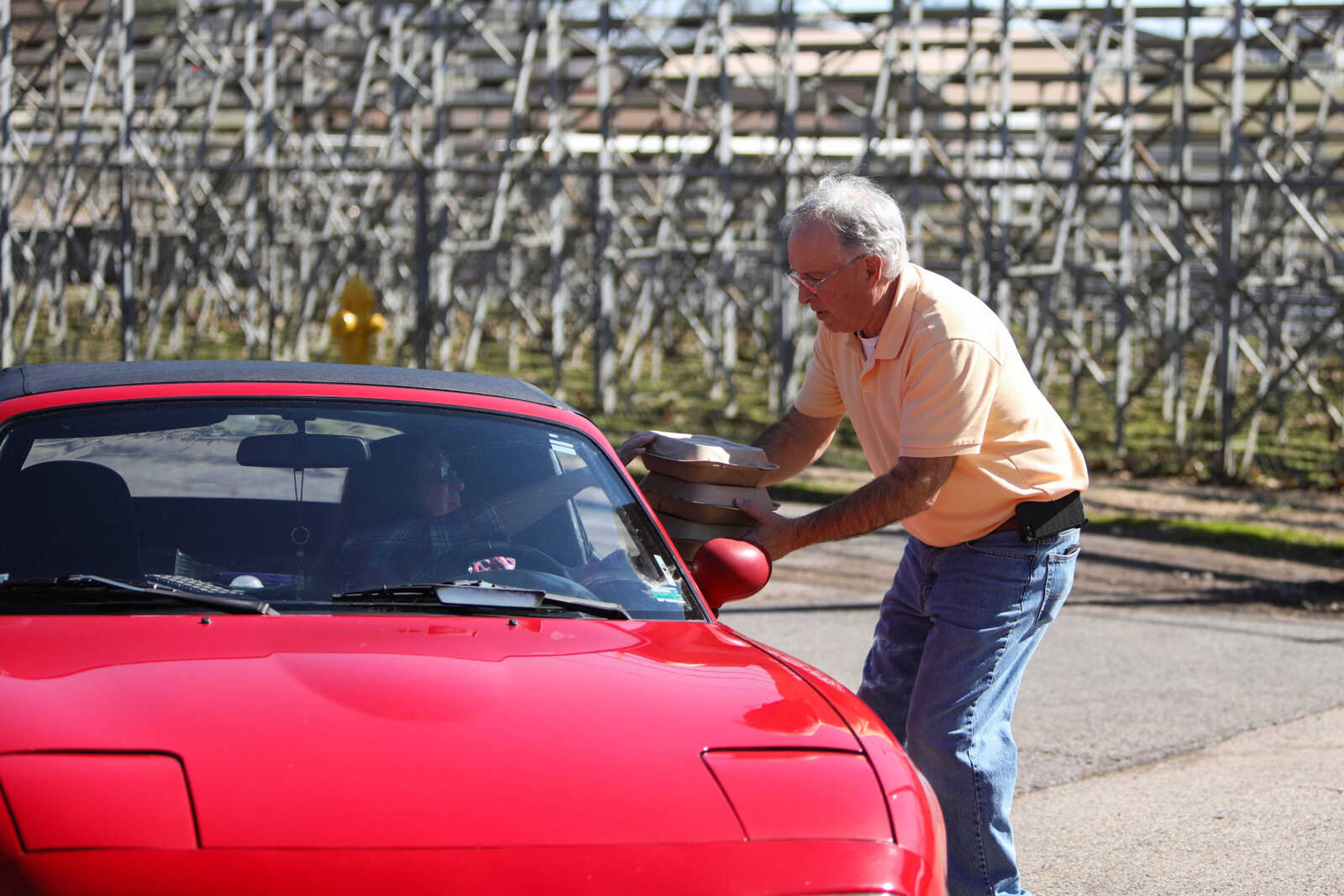 Lions Club member serve a customer