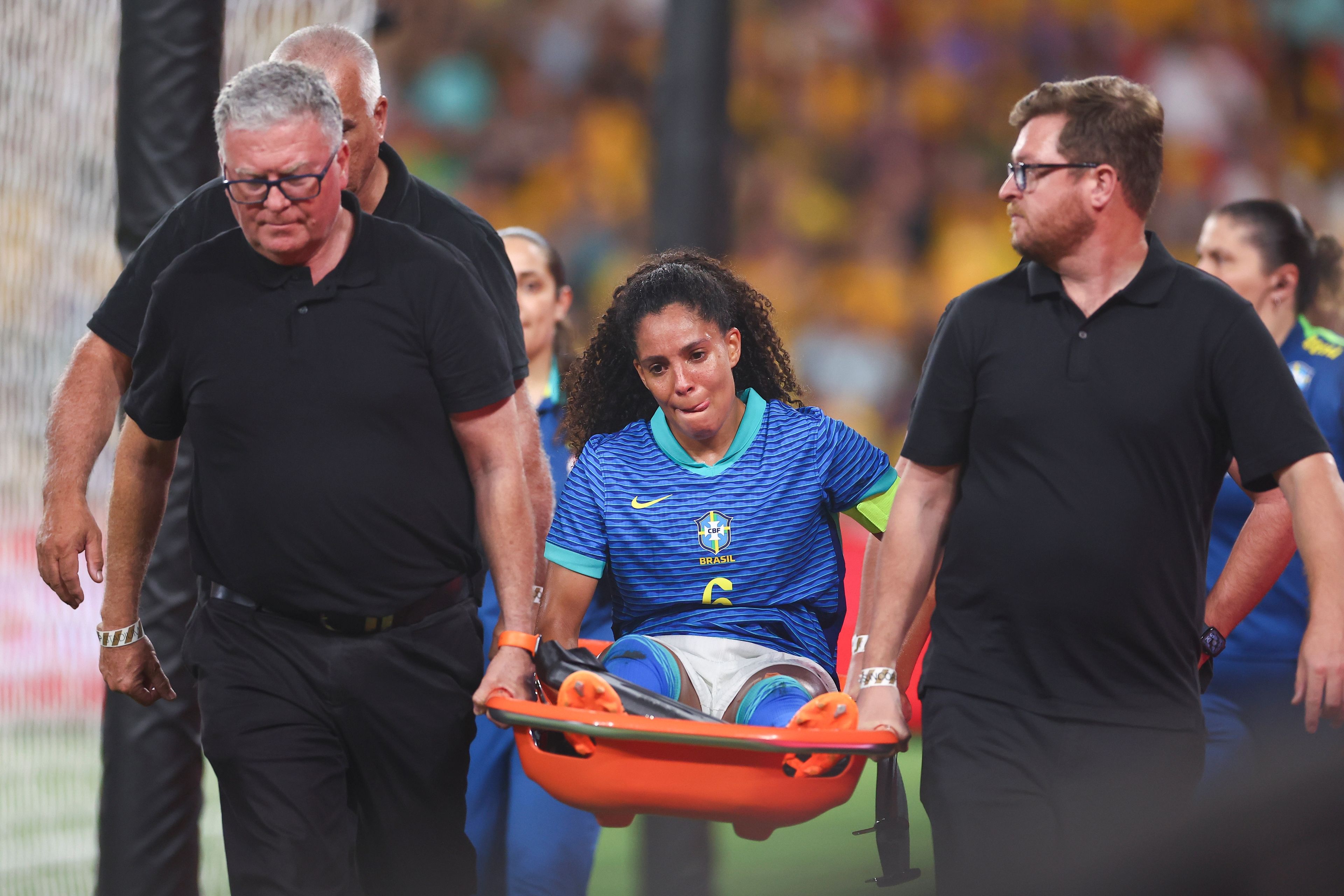 Brazil's Yasmin reacts as she is carried from the field during a soccer international between Brazil and Australia in Brisbane, Australia, Thursday, Nov. 28, 2024. (AP Photo/Pat Hoelscher)