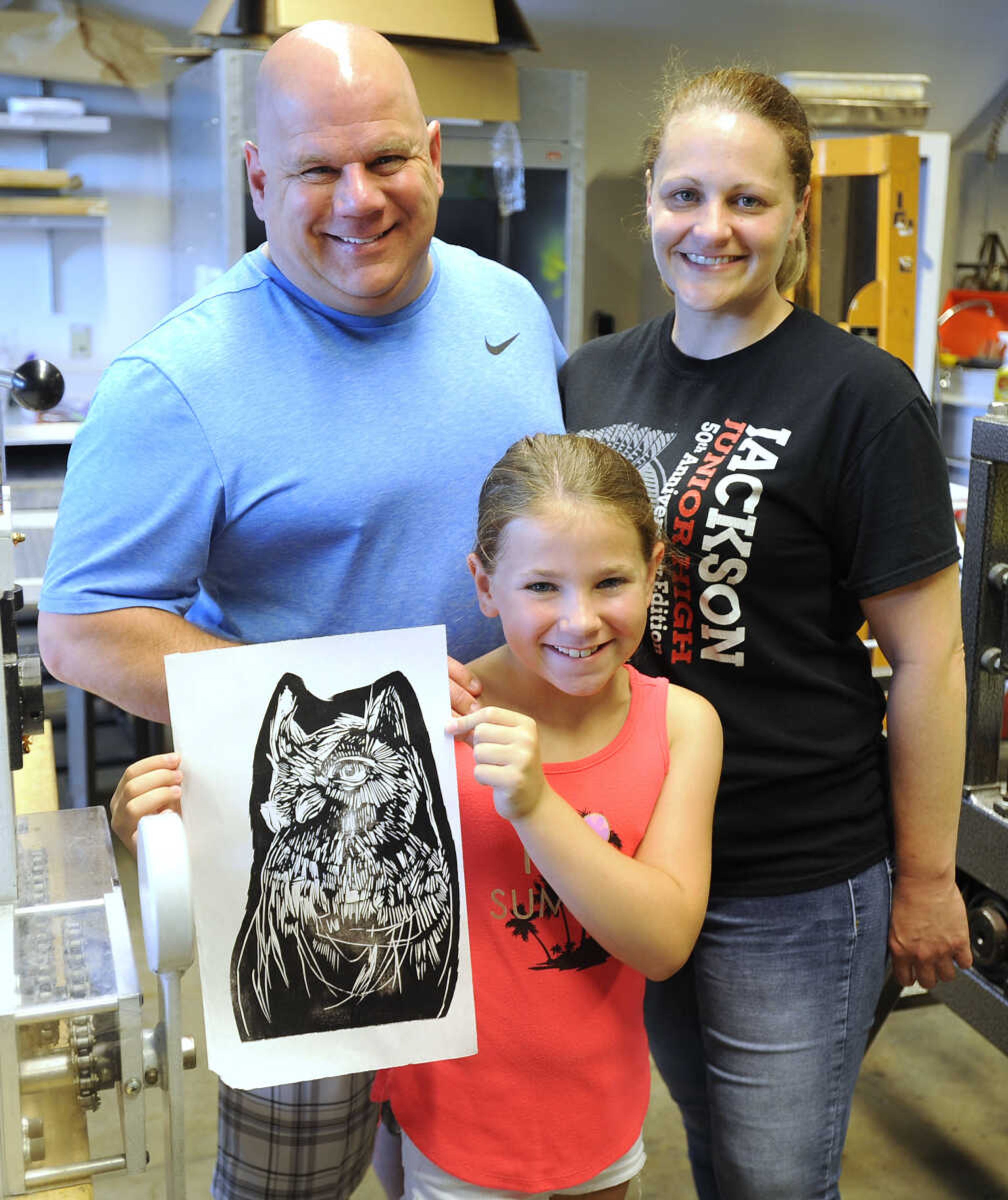 FRED LYNCH ~ flynch@semissourian.com
Kerrigan Murphy and her parents, Delbert and Laura Murphy, pose for a photo with the print she made Saturday, June 16, 2018 at the Summer Arts Festival at the River Campus.