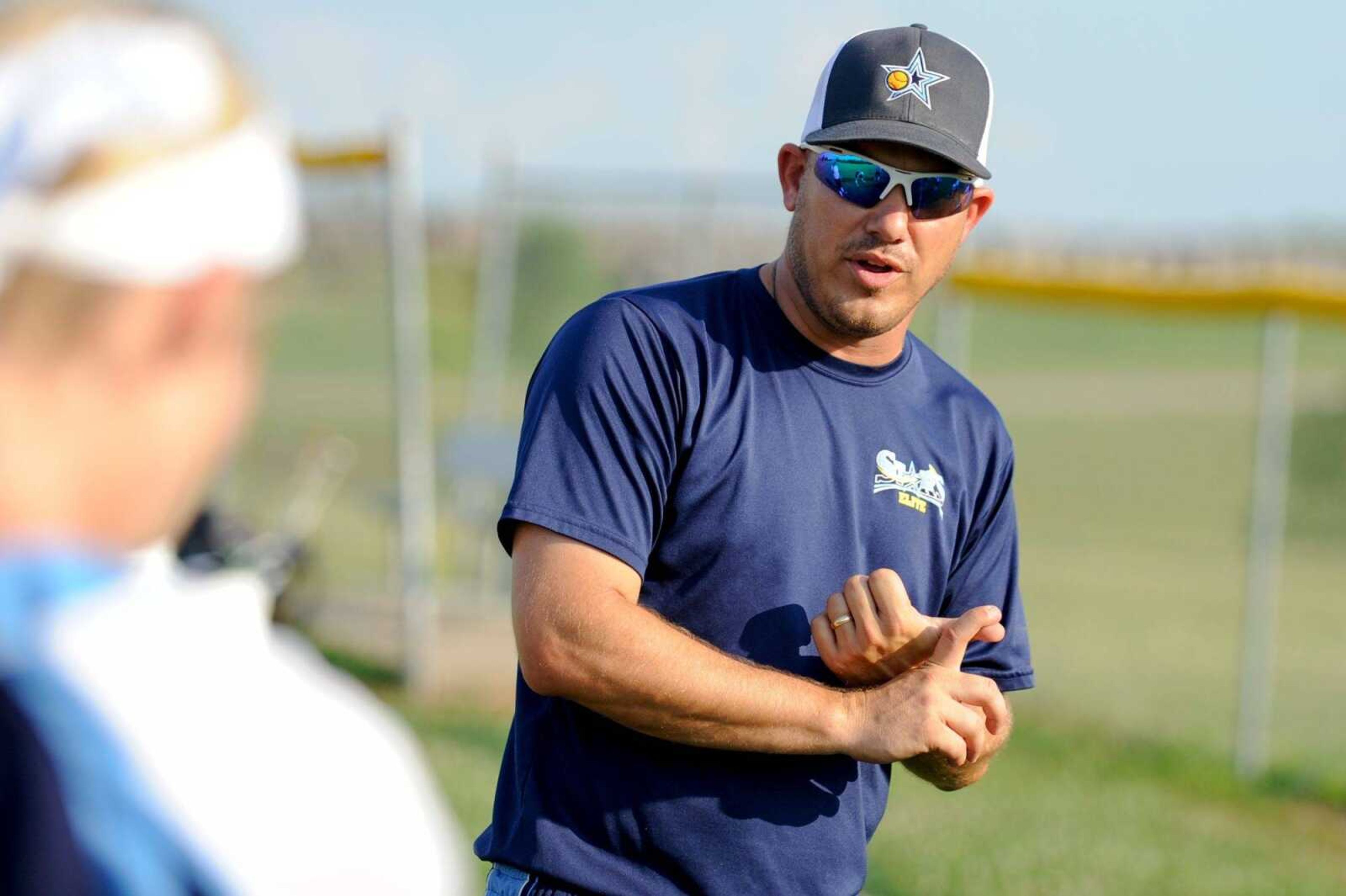 Stars Elite coach Jared Hotop talks with players during practice last week. Hotop co-founded the Perryville Stars program in 2009.