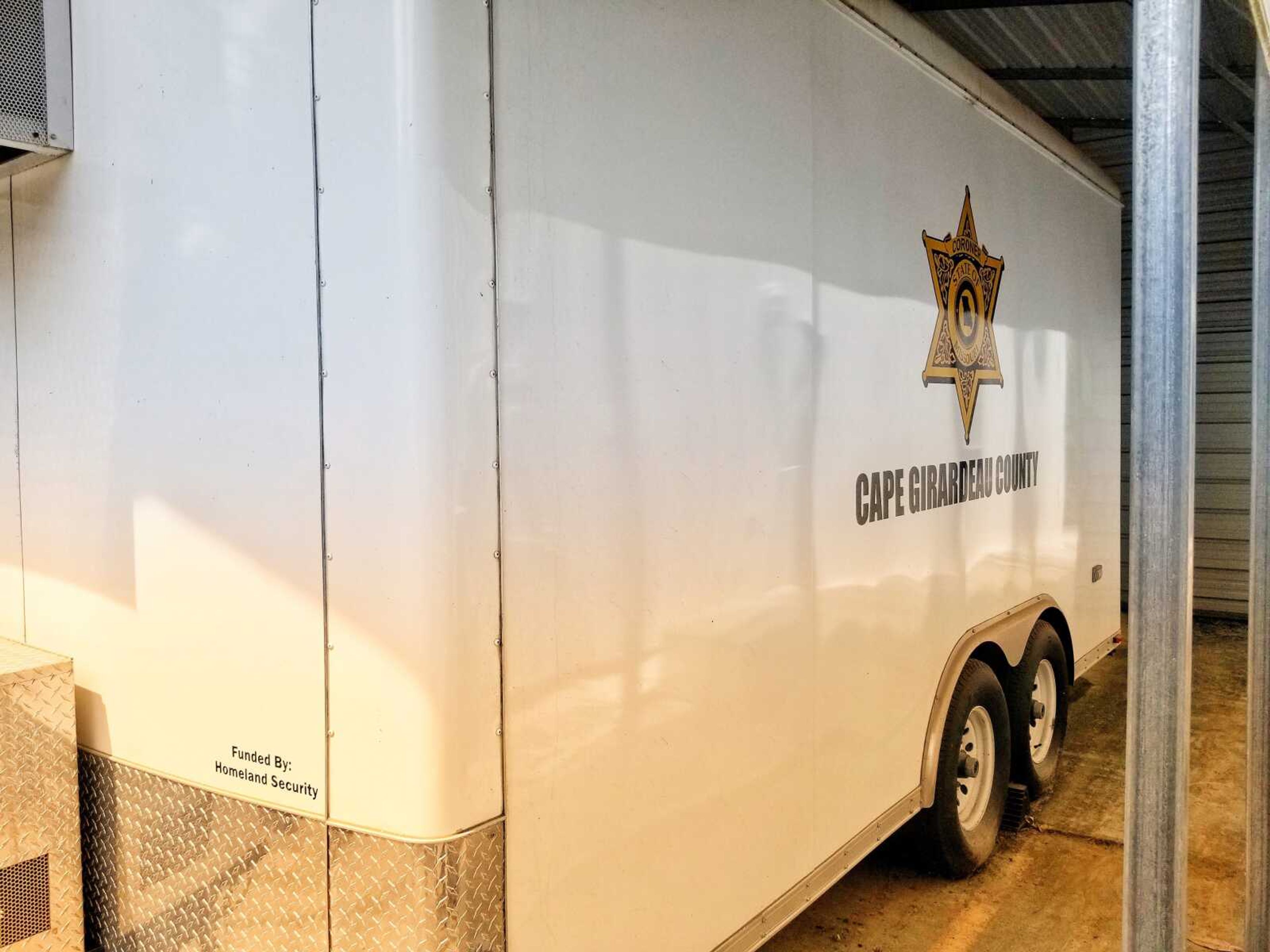 A mass fatality trailer, purchased with funds received from the U.S. Department of Homeland Security, is parked next to the Cape Girardeau County coroner's office on North West End Boulevard in Cape Girardeau. The trailer and other county-owned emergency equipment are expected to be housed in a new county emergency management center being contemplated by Cape County's commission. Request for Qualification bids (RFQ) for a projected EMA center were received from two companies Thursday.