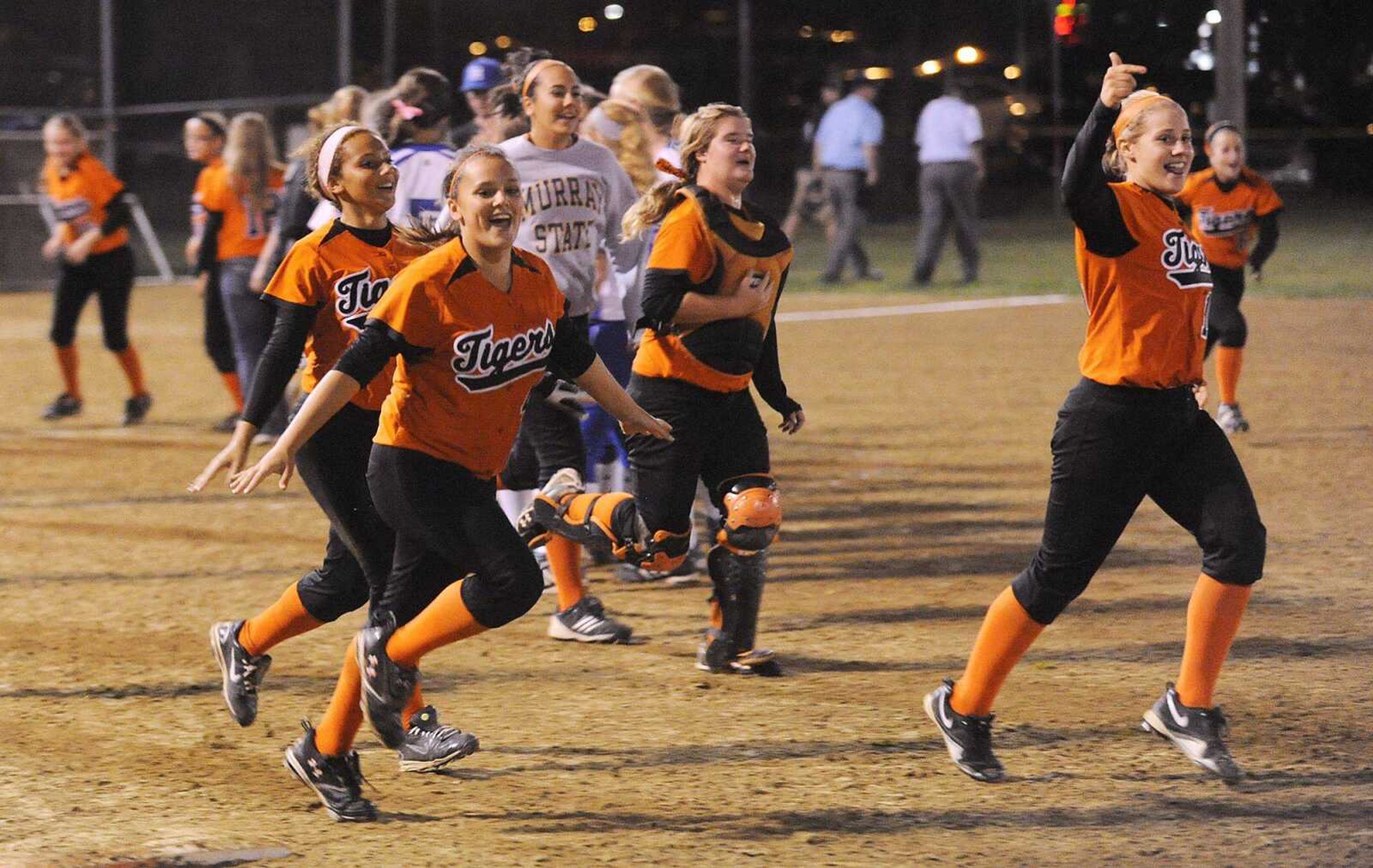 Central players celebrate their 10-5 win over Hillsboro Wednesday during the Class 4 District 1 softball tournament at Jackson City Park.<br>ADAM VOGLER<br>avogler@ semissourian.com