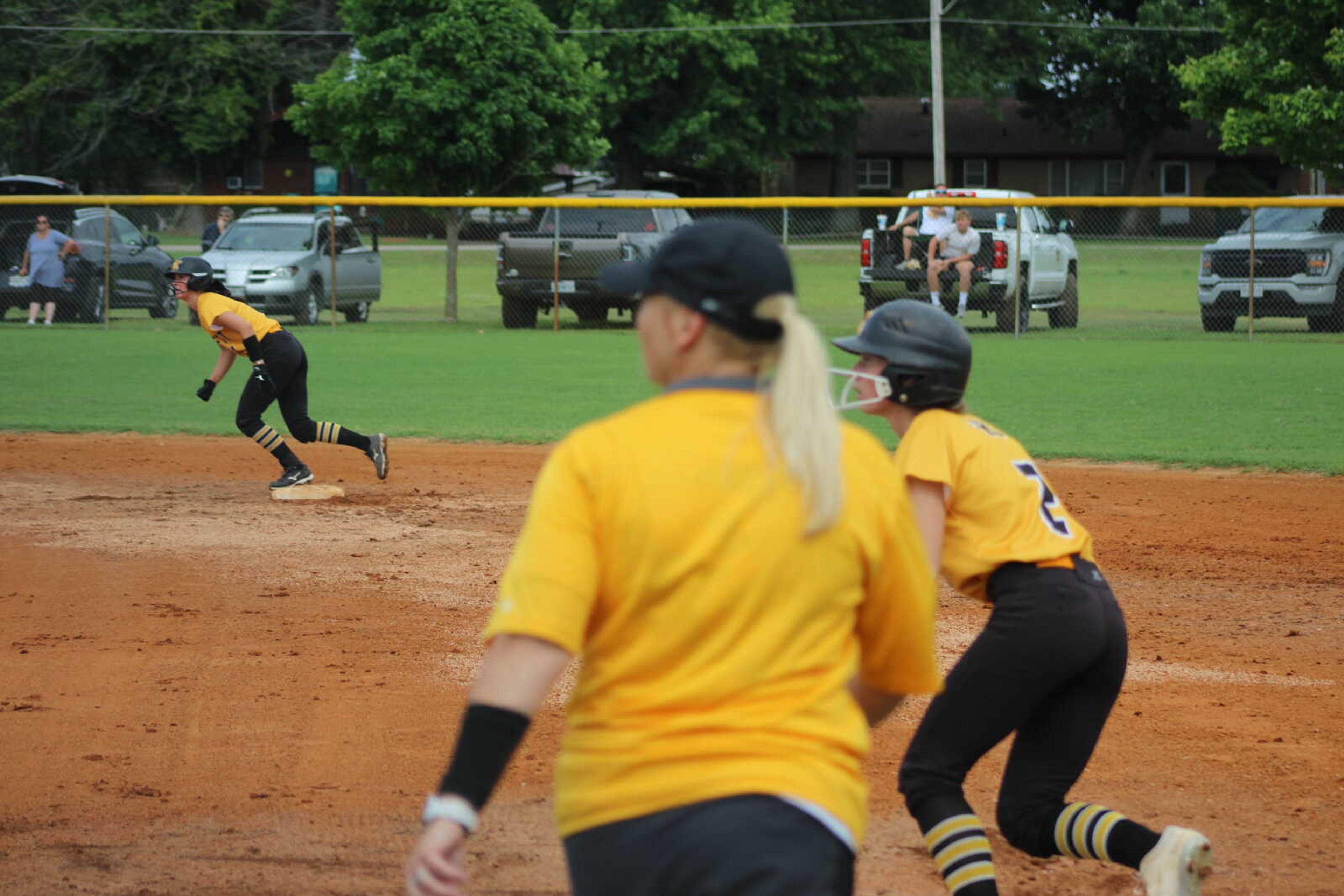 Kennett Lady Indians pitcher Handley McAtee eyes third after her teammate Hadley Wilson knocked a screamer into left Monday at Malden.