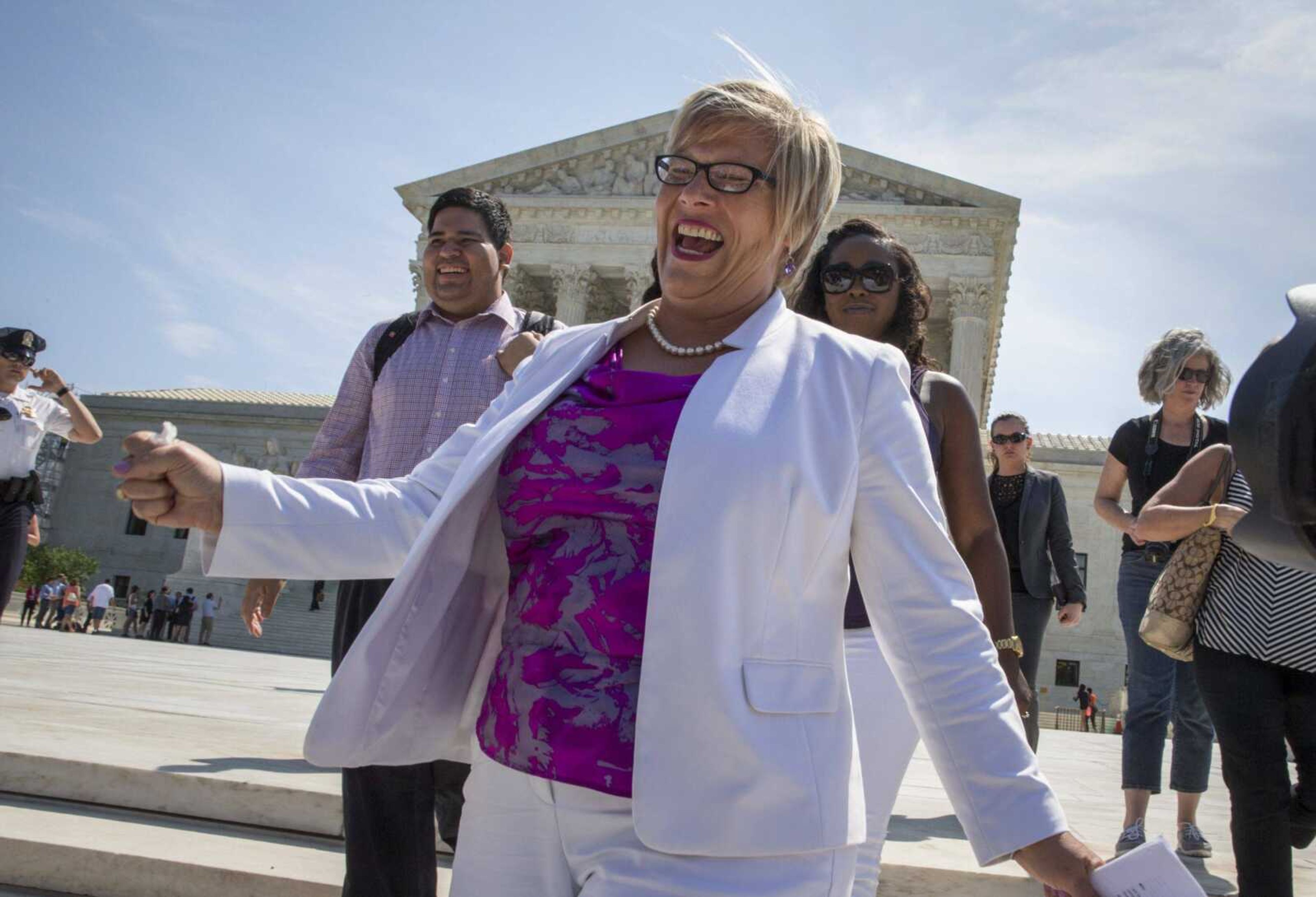 Amy Hagstrom Miller, founder of Whole Woman's Health, a Texas clinic that provides abortions, rejoices Monday as she leaves the Supreme Court in Washington after the justices struck down a Texas anti-abortion restriction law.