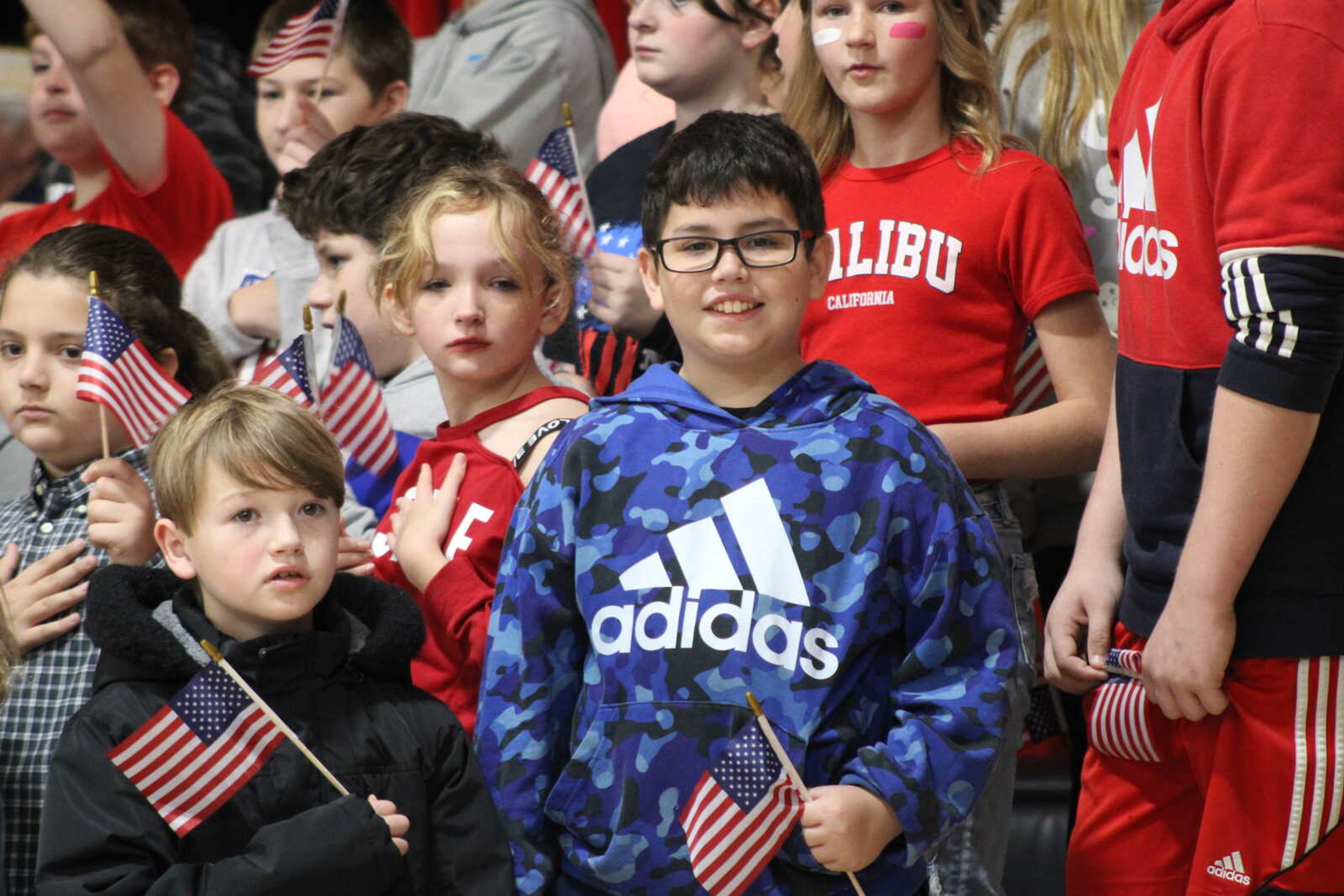 Chaffee fifth grader, Jayce Pequeno, smiles while waiting to sing the National Anthem&nbsp;