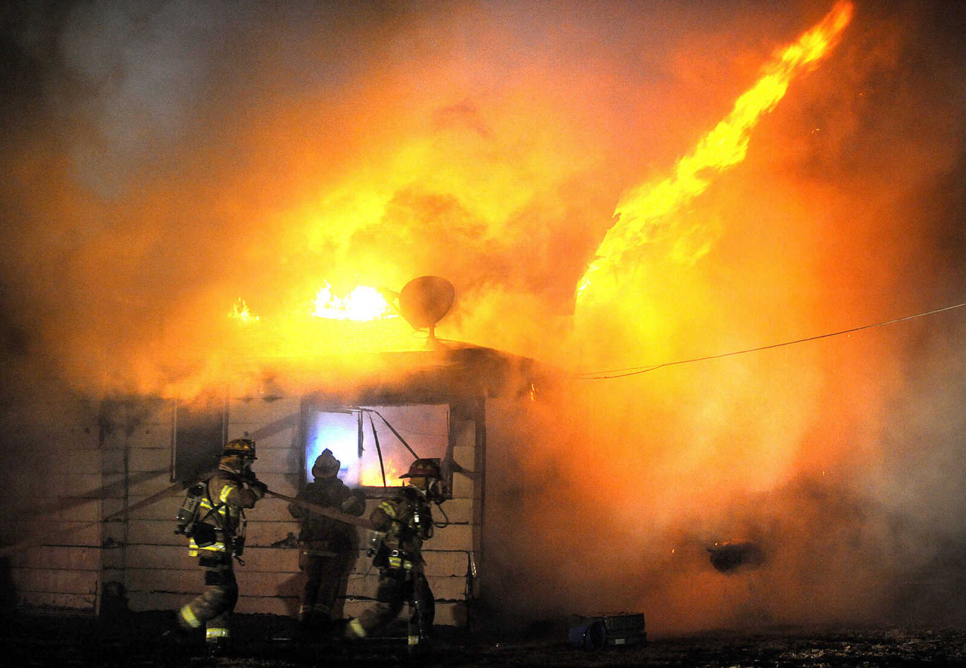 LAURA SIMON ~ lsimon@semissourian.com

Members of the Scott City and Cape Girardeau fire departments battle a blaze at 308 W. Missouri Blvd. in Scott City, Wednesday, Dec. 18, 2013. Nobody was injured in the fire.