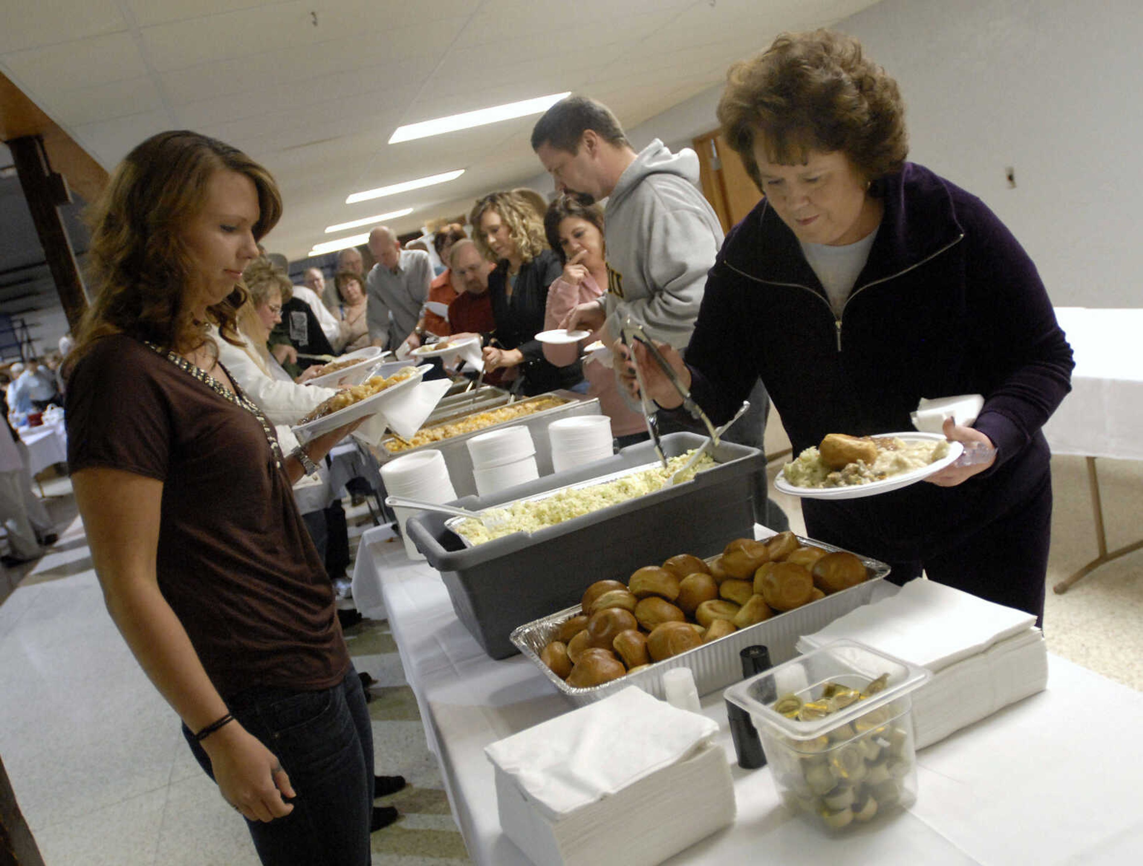 KRISTIN EBERTS ~ keberts@semissourian.com

Dinner awaits hungry guests during the Humane Society of Southeast Missouri's 30th annual Dinner and Auction titled "Tales of Tails" on March 26, 2011, at the A.C. Brase Arena in Cape Girardeau. The event included dinner, awards, raffles and silent and oral auctions with proceeds benefitting the Humane Society.