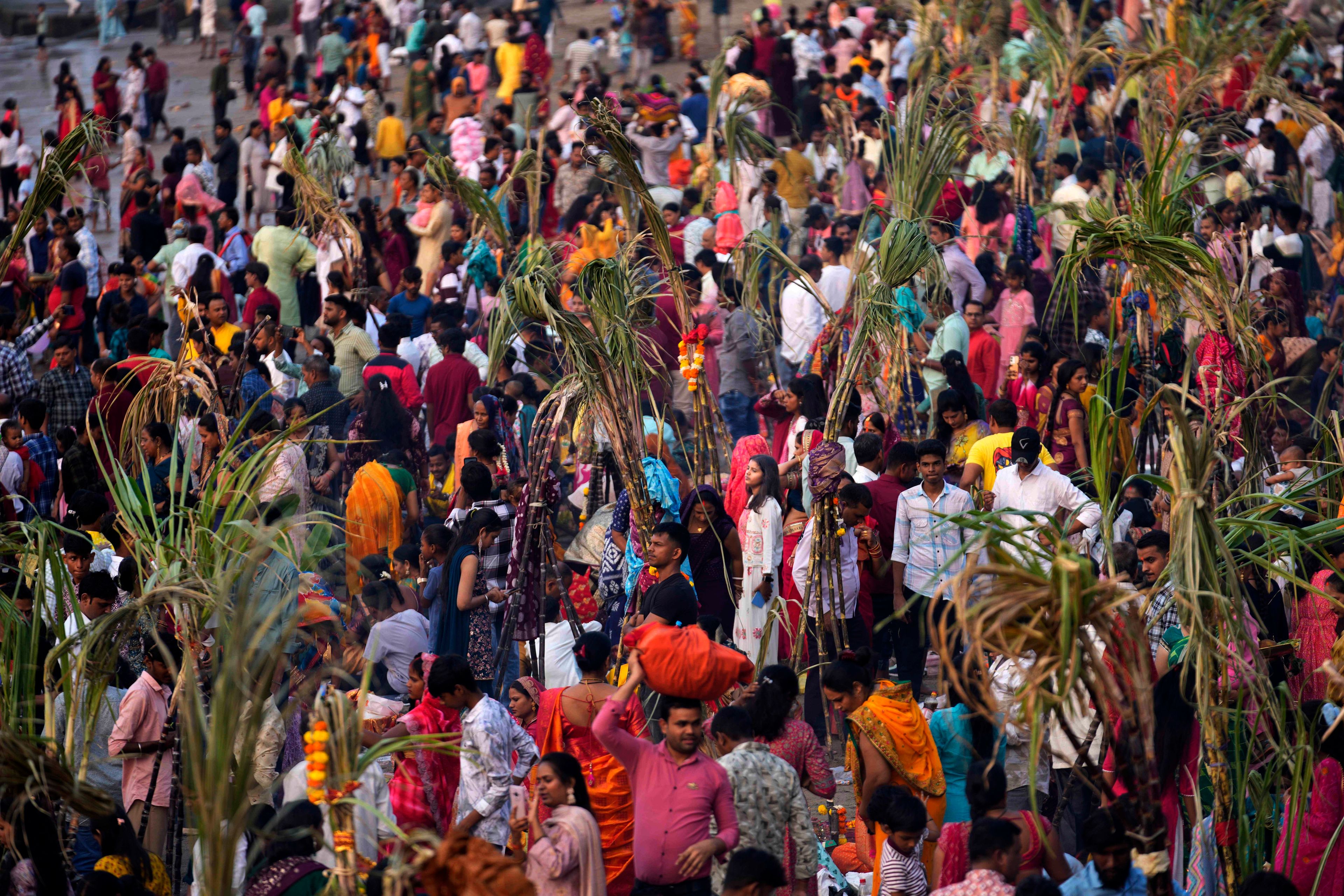 AP PHOTOS: Tens of thousands of Hindu devotees flock to rivers for prayers to the sun god