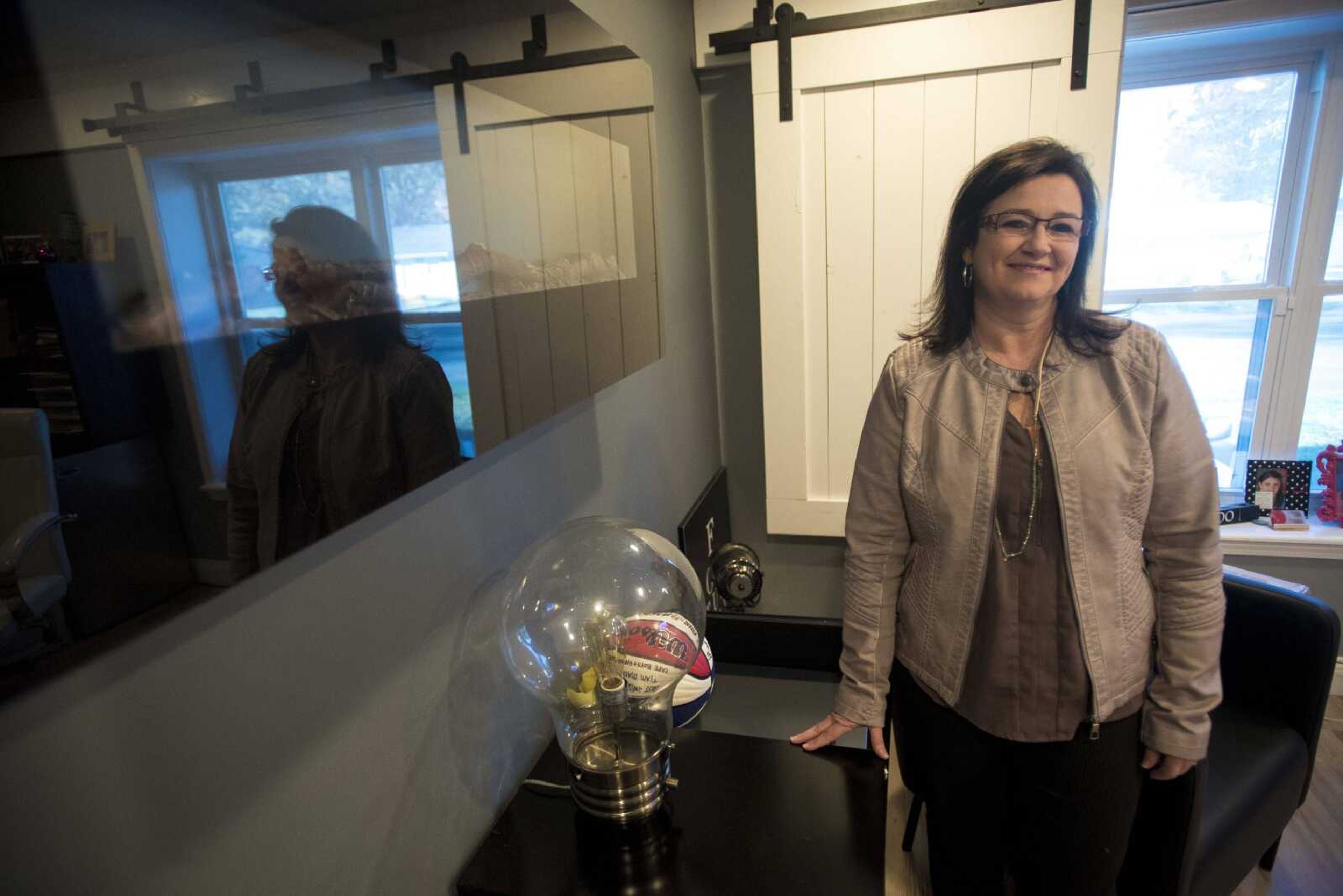 Cutline-Body Copy:Dana Thomas with BOLD! Marketing poses for a photo in her office Thursday, Nov. 9, in Cape Girardeau.