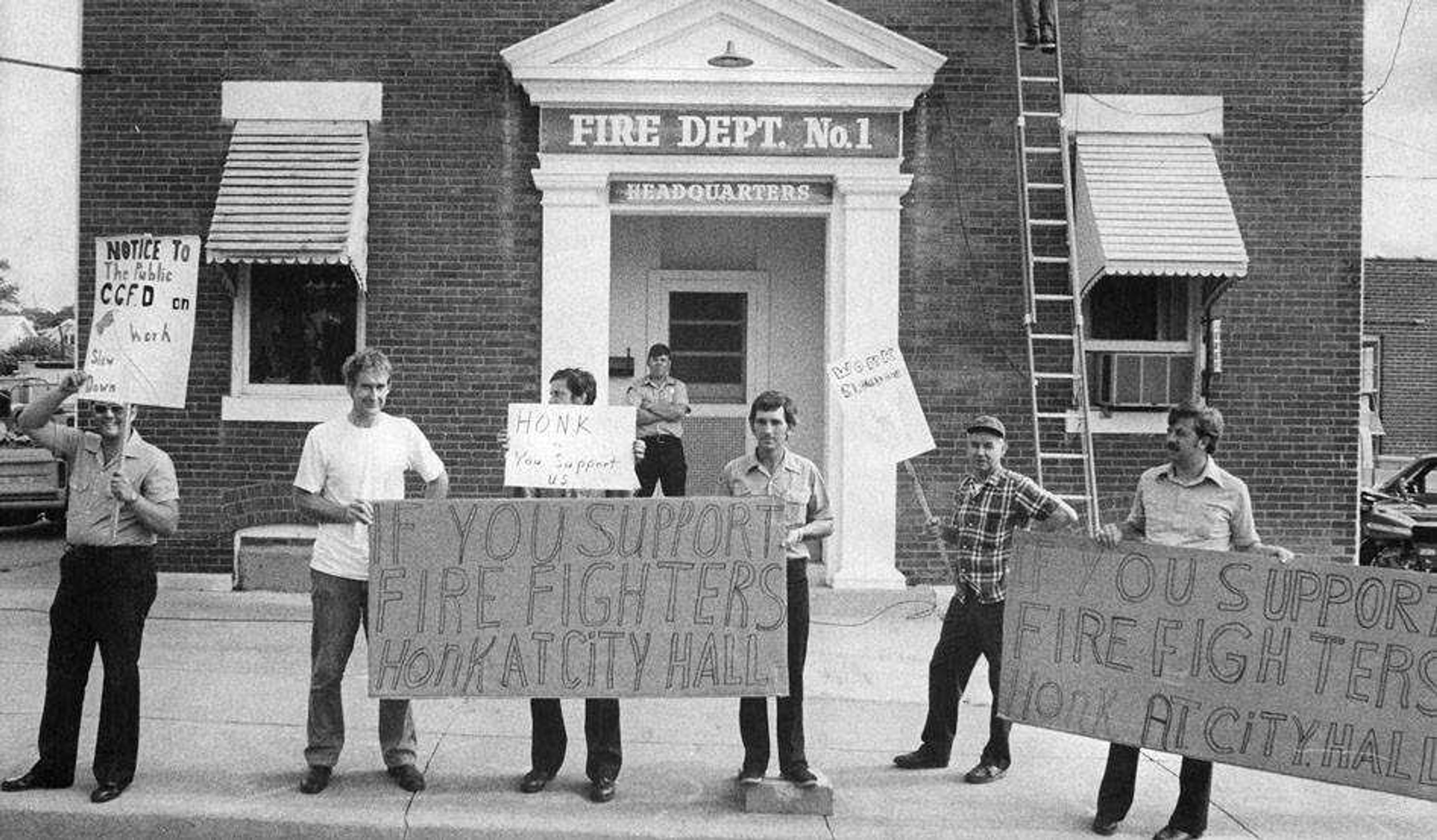 Striking firefighters stand outside Fire Station No. 1 in February 1979.