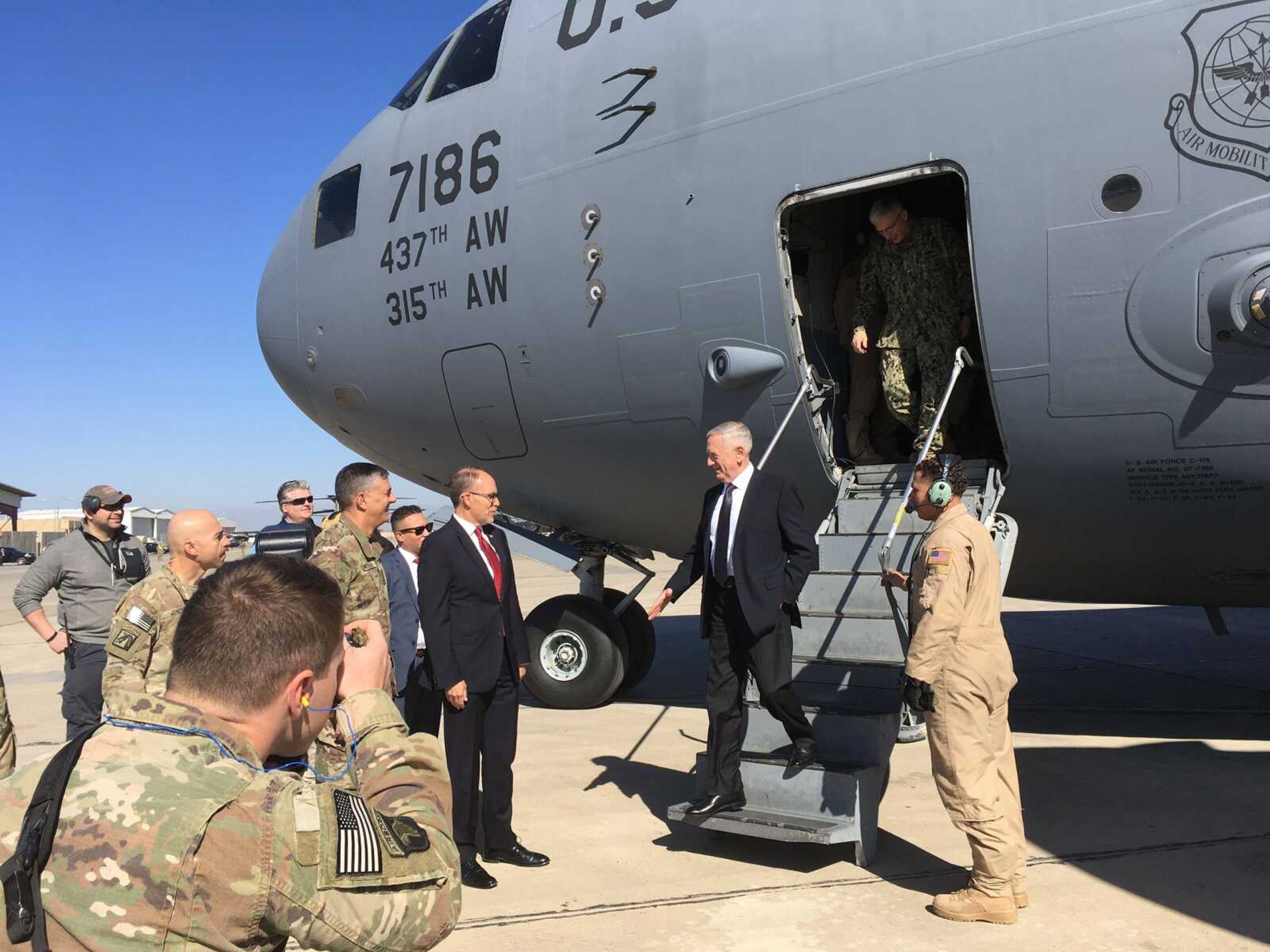 U.S. Secretary of Defense Jim Mattis is greeted by U.S. Ambassador Douglas Silliman as he arrives Monday at Baghdad International Airport.