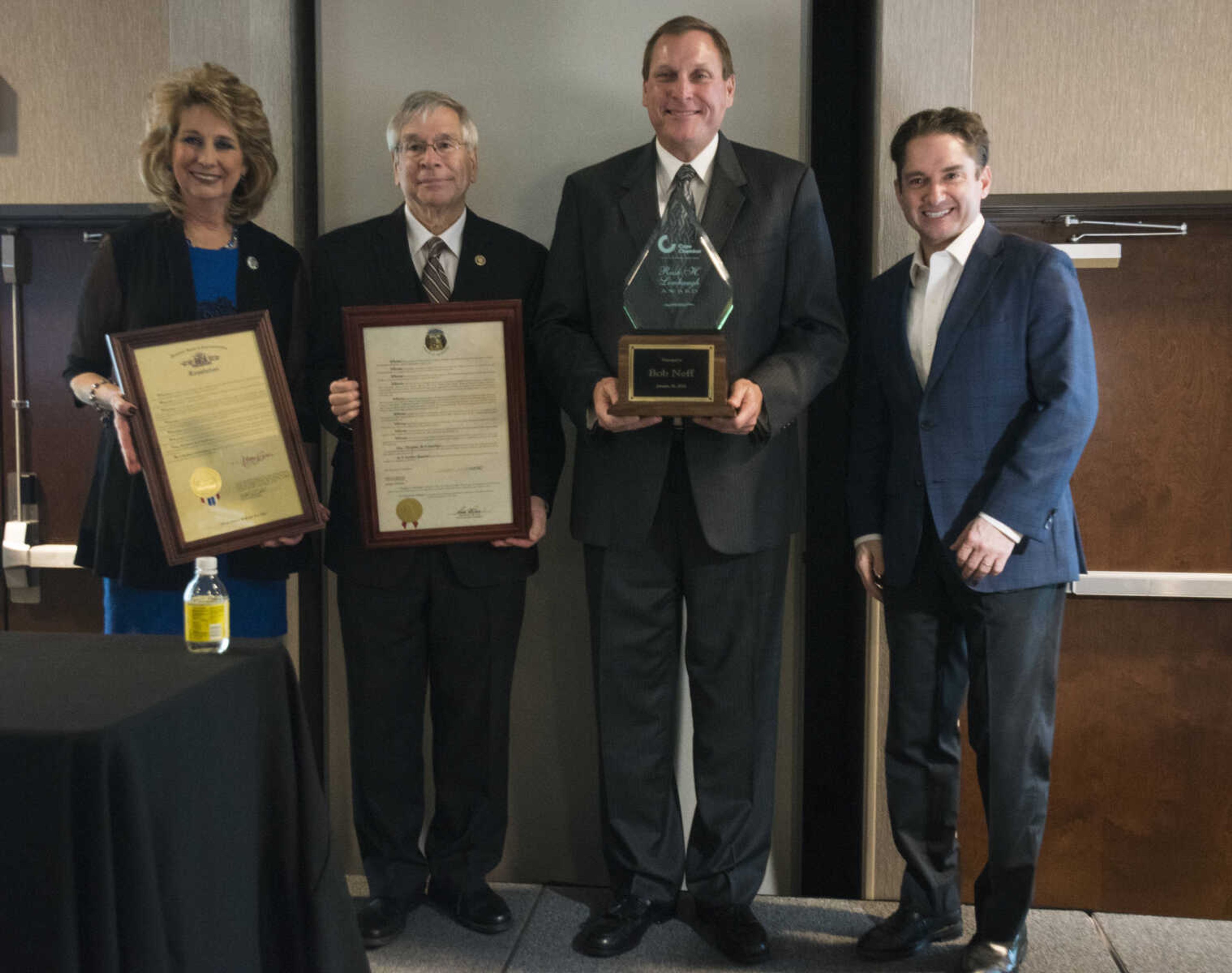 From left, State Rep. Kathy Swan, Sen. Wayne Wallingford, Rush H. Limbaugh Award recipient Bob Neff and outgoing chairman of the chamber board Jon K. Rust pose for a photo at the Cape Girardeau Area Chamber of Commerce's annual dinner held Jan. 26, 2018, at the Drury Plaza Conference Center in Cape Girardeau.