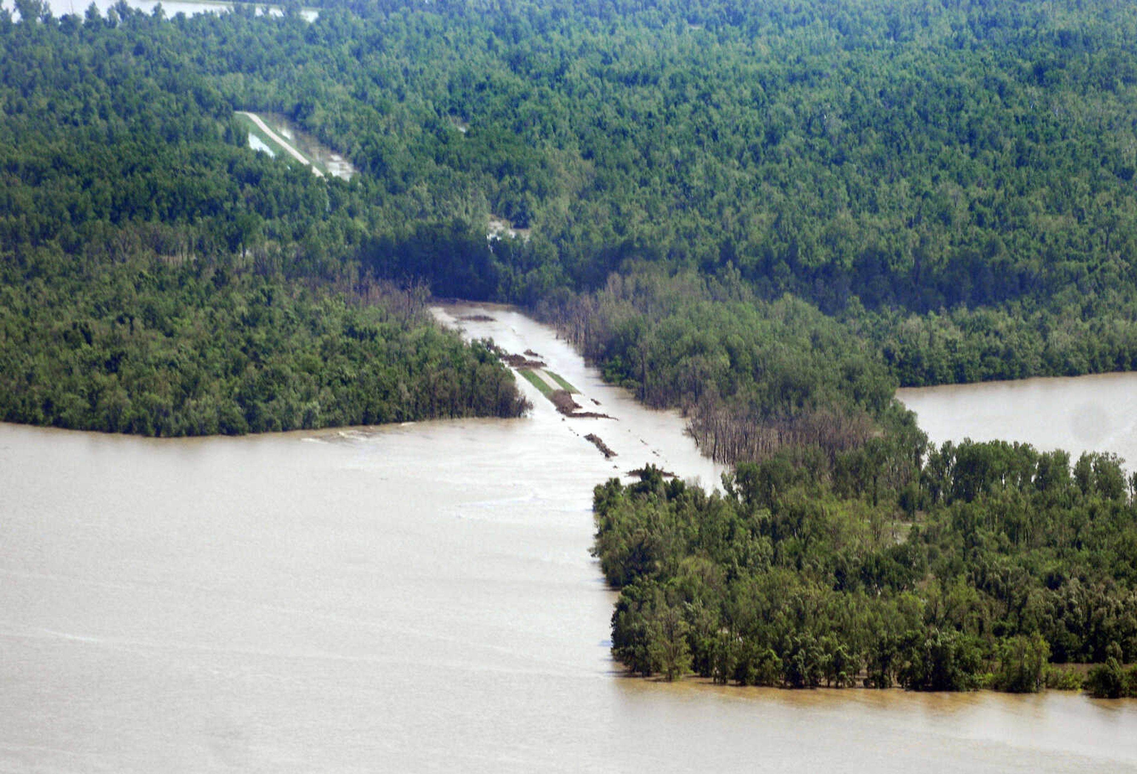 KRISTIN EBERTS ~ keberts@semissourian.com

Water flows over the breached section of levee near New Madrid, Mo., after it was intentionally breached on Tuesday, May 3, 2011. On May 2, Maj. Gen. Michael Walsh gave the order to activate the Birds Point-New Madrid floodway, covering over 130,000 acres of farmland to ease flooding upstream.