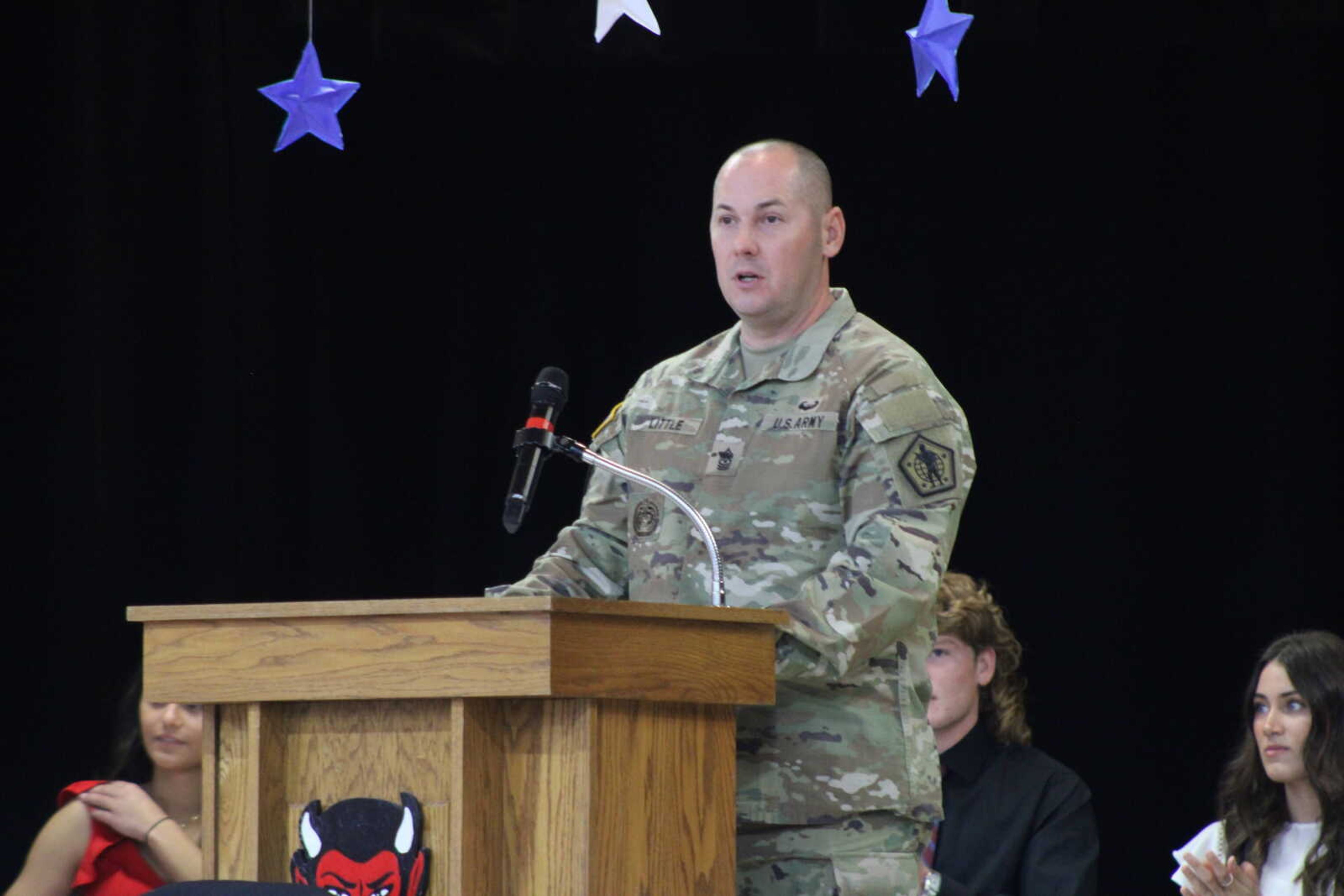 United States Army Sergeant Major David Little speaks to the audience about his service.