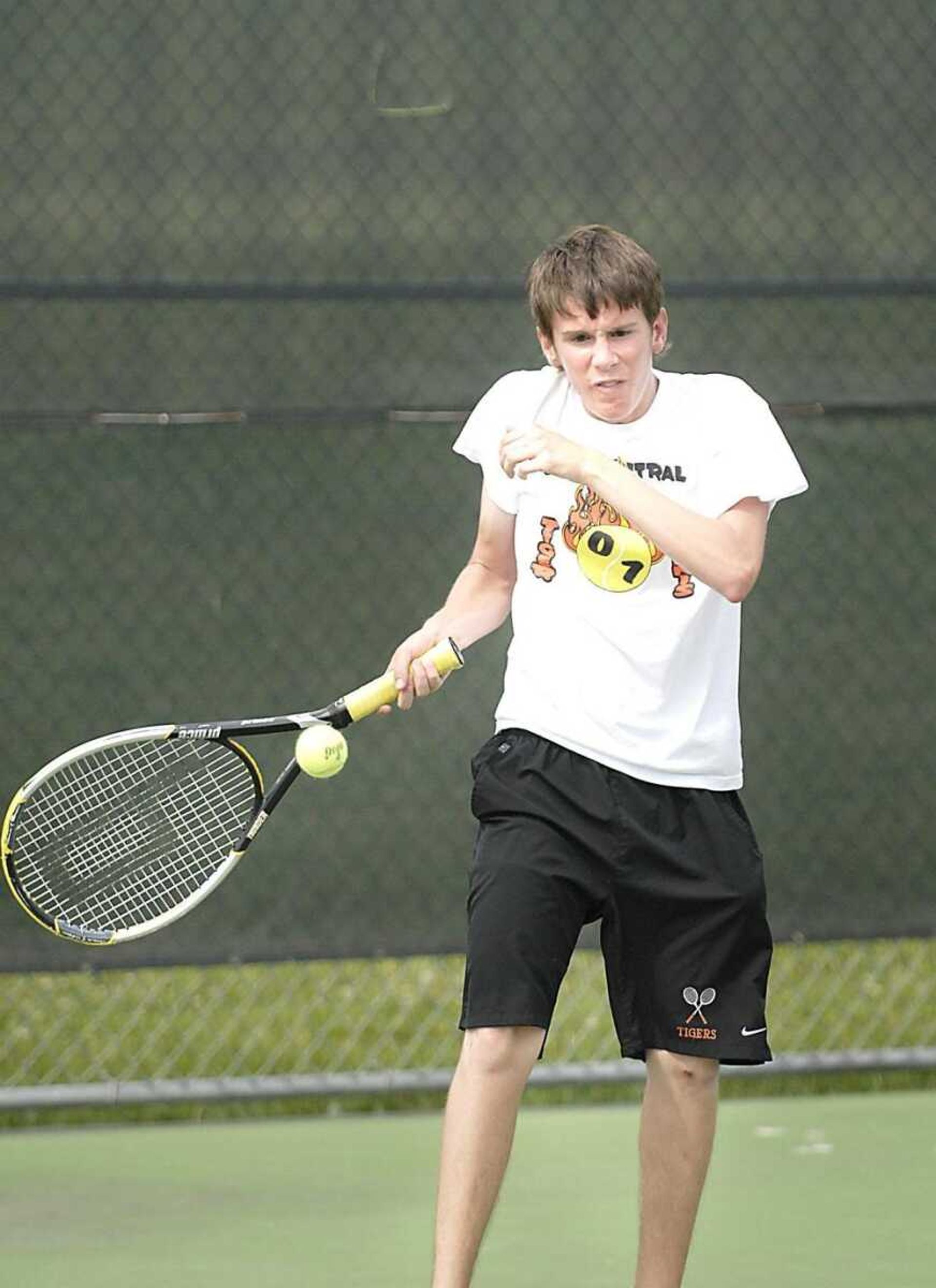 Central junior Patrick Duffy returned a serve during doubles play against Eureka on Tuesday. Duffy won both in singles and doubles. (Kit Doyle)