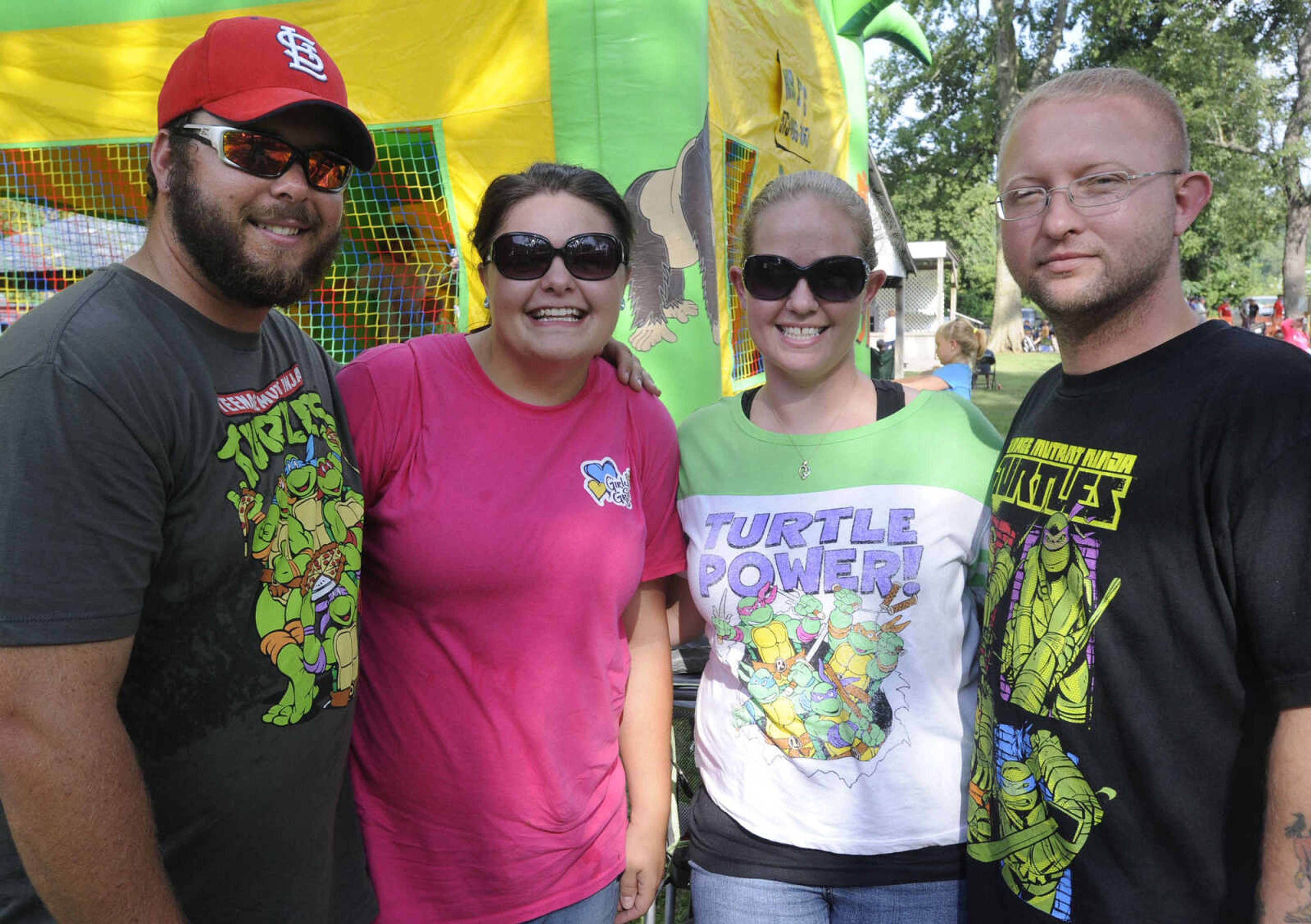 Jeremy Halbert, left, Kayleigh Halbert, Elizabeth Cook and Nicholas Cook pose for a photo at German Days on Saturday, Aug. 9, 2014 at Frisco Park in Chaffee, Missouri.