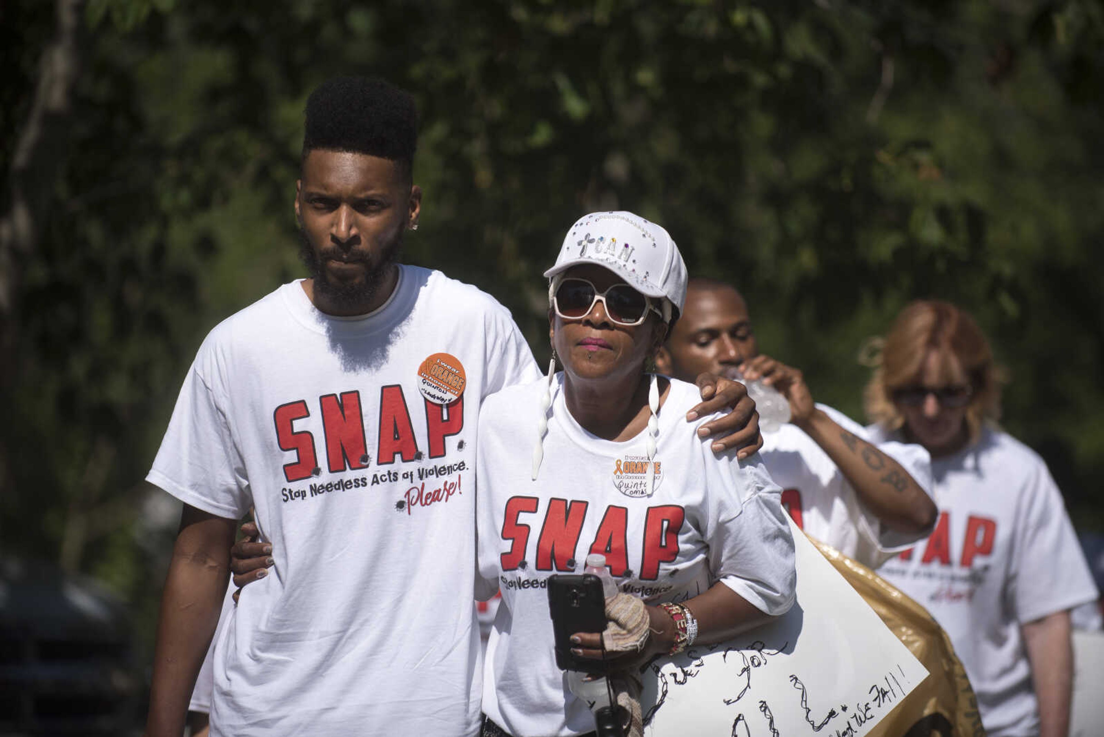 Community Members march during a Stop Needless Acts of Violence Please (SNAP) prayer march Saturday, June 10, 2017 in Cape Girardeau.