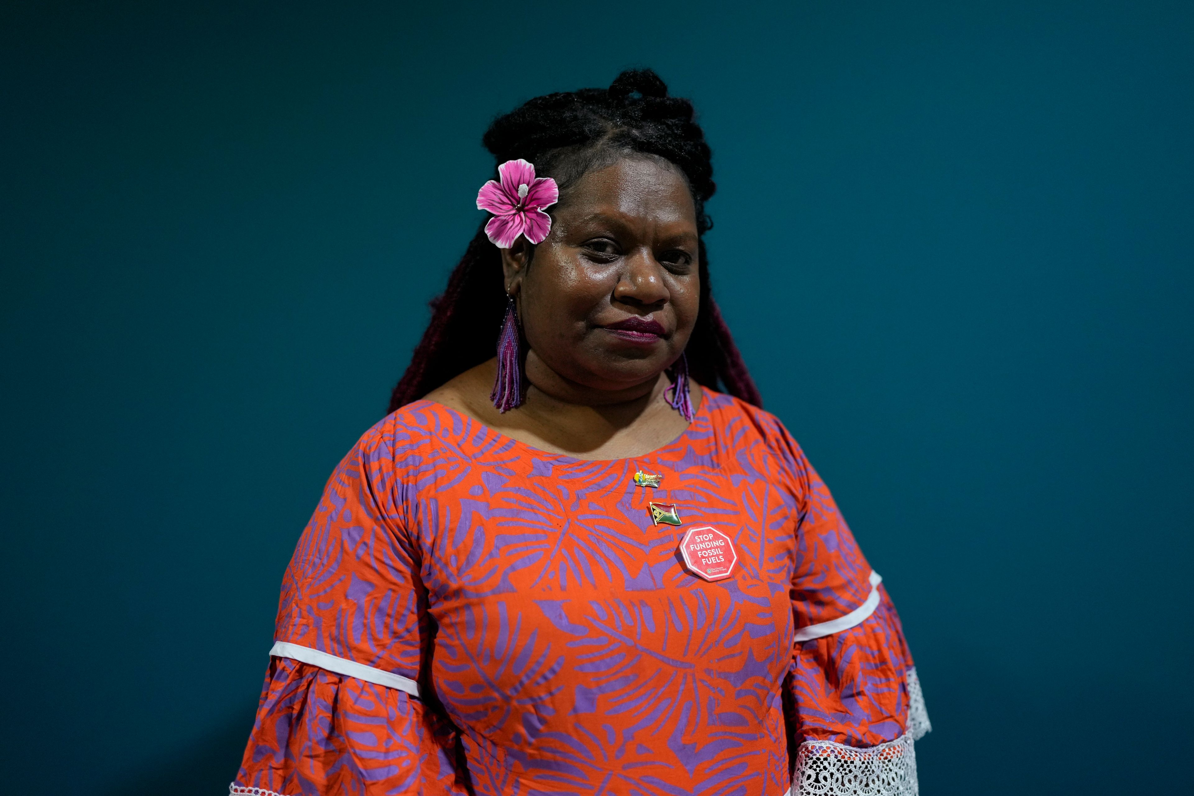 Flora Vano, 39, of Port Vila, Vanuatu, from the Melenasian community, poses for a photo during the COP29 U.N. Climate Summit, Saturday, Nov. 16, 2024, in Baku, Azerbaijan. (AP Photo/Rafiq Maqbool)