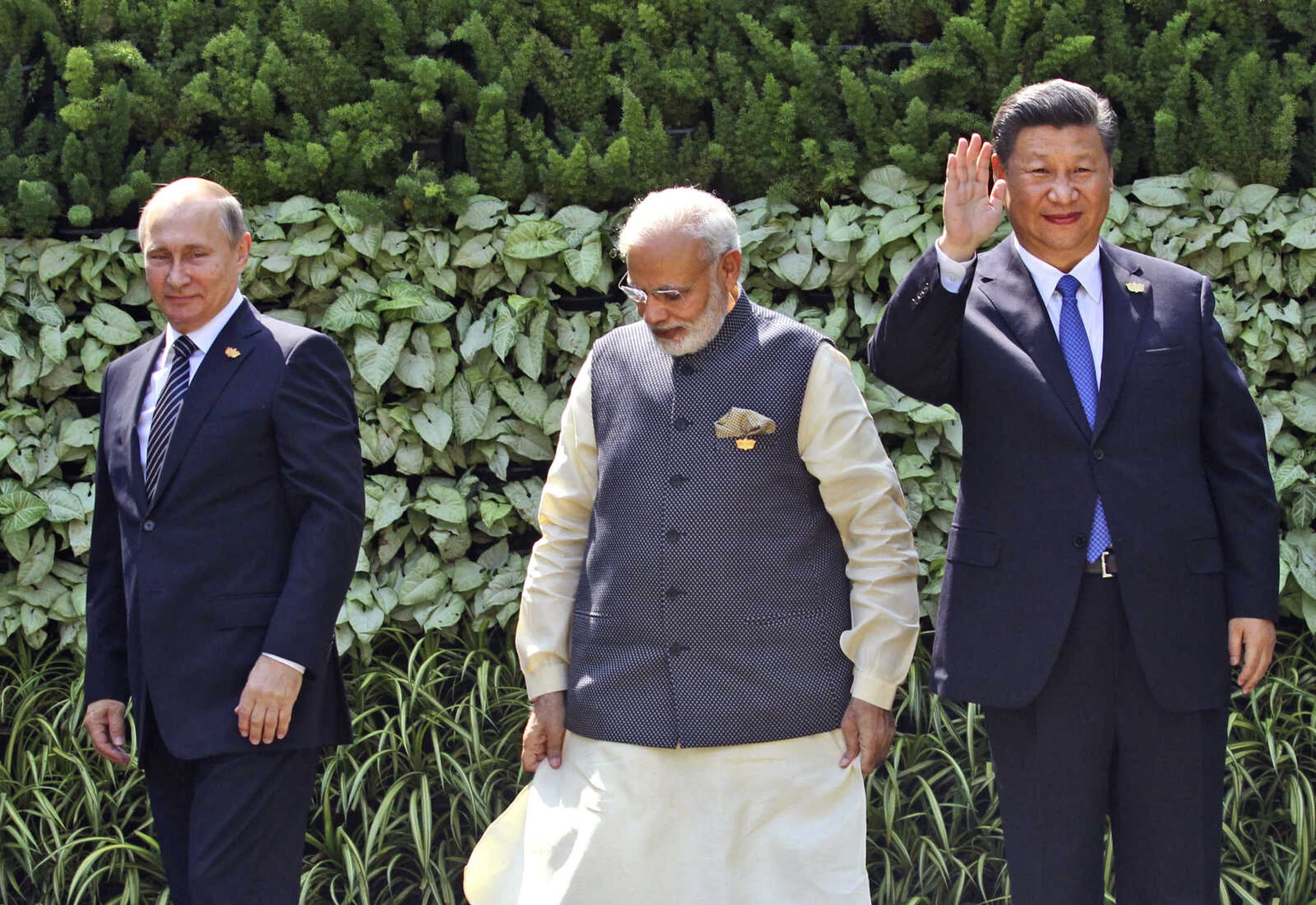 FILE- Russian President Vladimir Putin, Indian Prime Minister Narendra Modi, and Chinese President Xi Jinping stand at the start of the BRICS Summit in Goa, India, Sunday, Oct. 16, 2016. Modi on Tuesday, July 4, 2023, took a veiled swipe at rival neighbor Pakistan and avoided mentioning the war in Ukraine while addressing a group of Asian countries led by China and Russia. In his opening speech to the Shanghai Cooperation Organization, he said the group should not hesitate to criticize countries that are  using terrorism as an instrument of its state policy.  (AP Photo/ Anupam Nath, File)