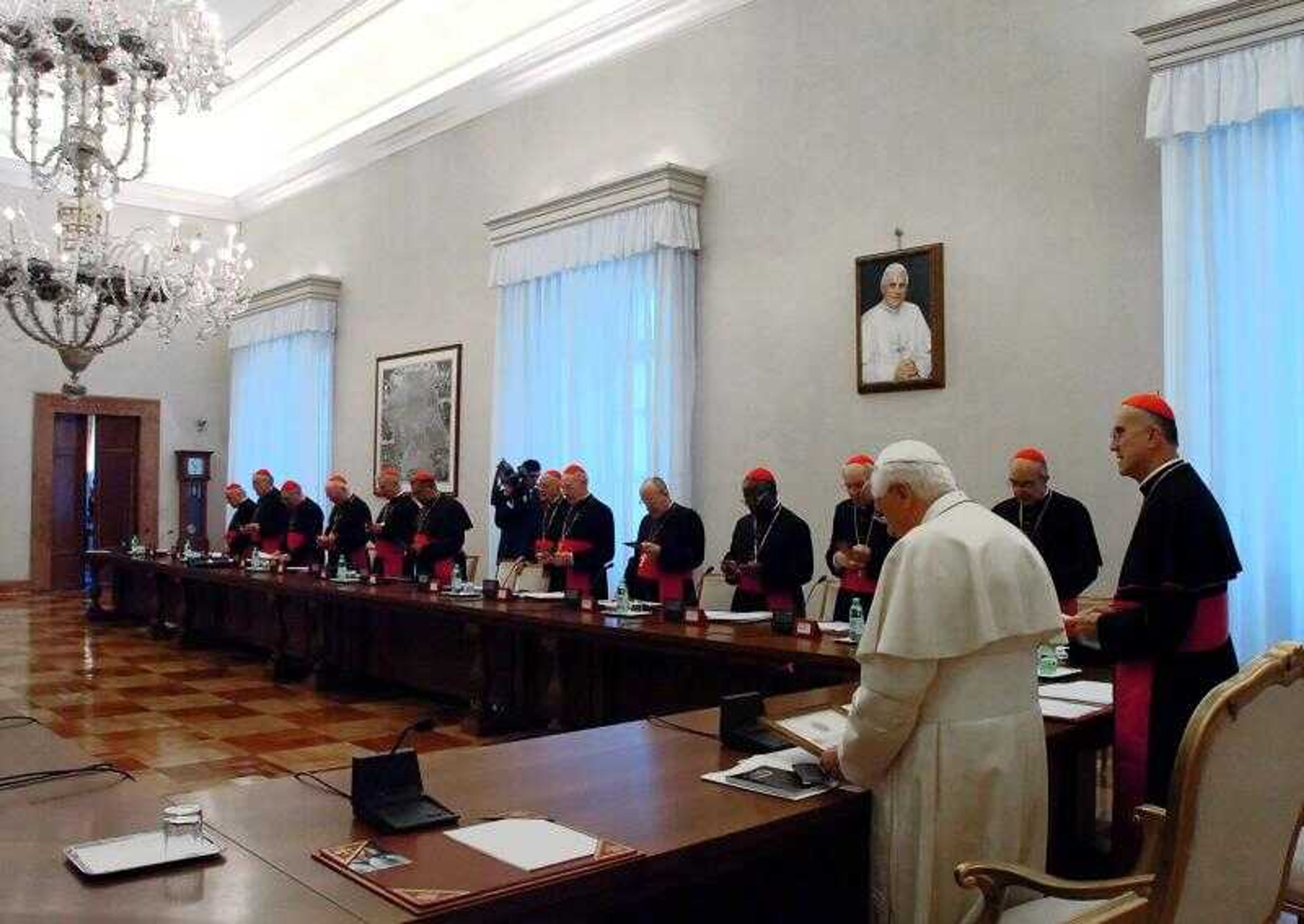 In this photo provided by the Vatican newspaper L'Osservatore Romano, Pope Benedict XVI presided over a meeting with Vatican top officials at the Vatican Sala Bologna Hall Thursday. The pontiff presided over a summit Thursday on the celibacy requirement for clergy.