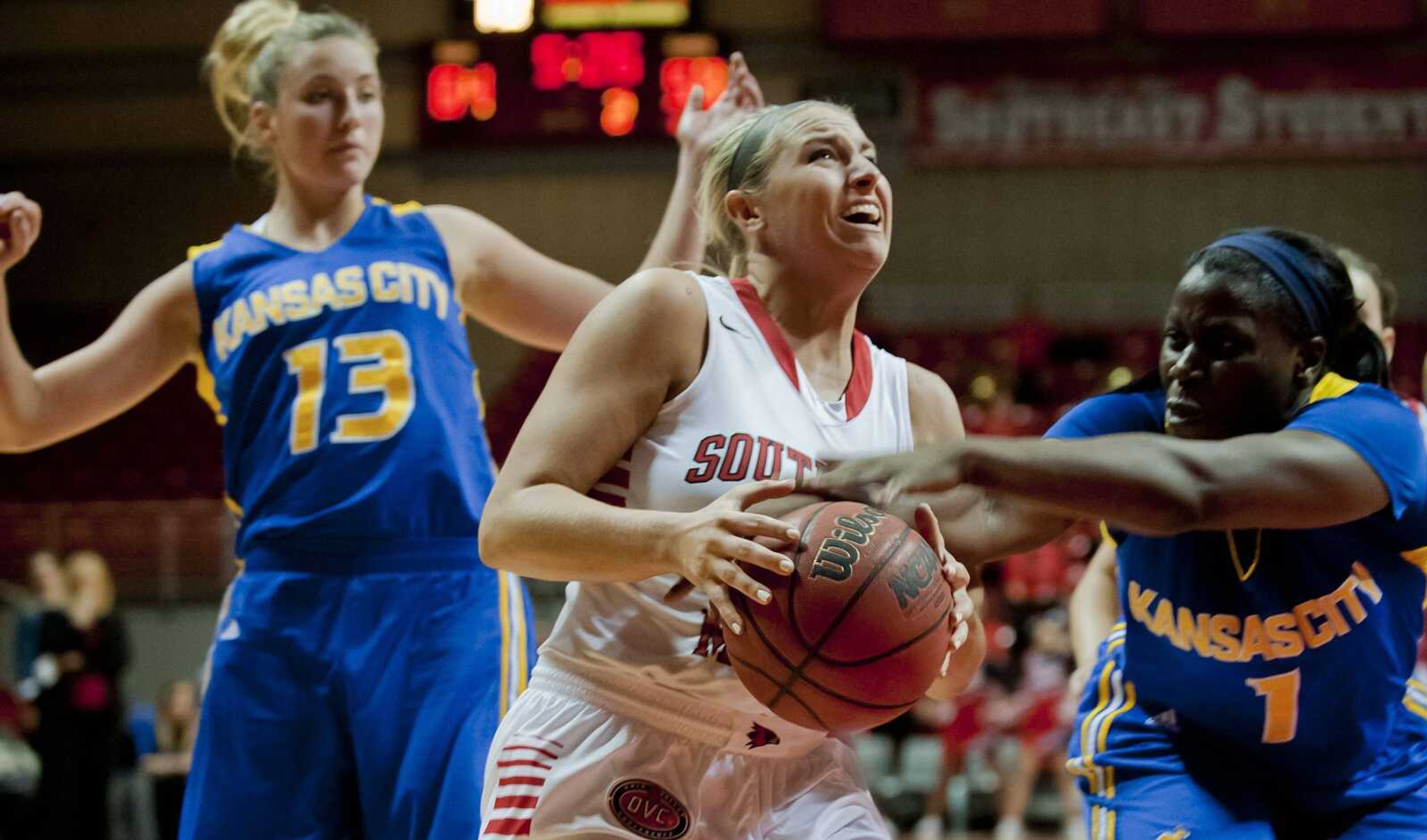 Southeast Missouri State guard Allyson Bradshaw is fouled by Missouri-Kansas City forward Kim Nezianya during the second half Thursday at the Show Me Center. The Redhawks won 76-74. (Adam Vogler)