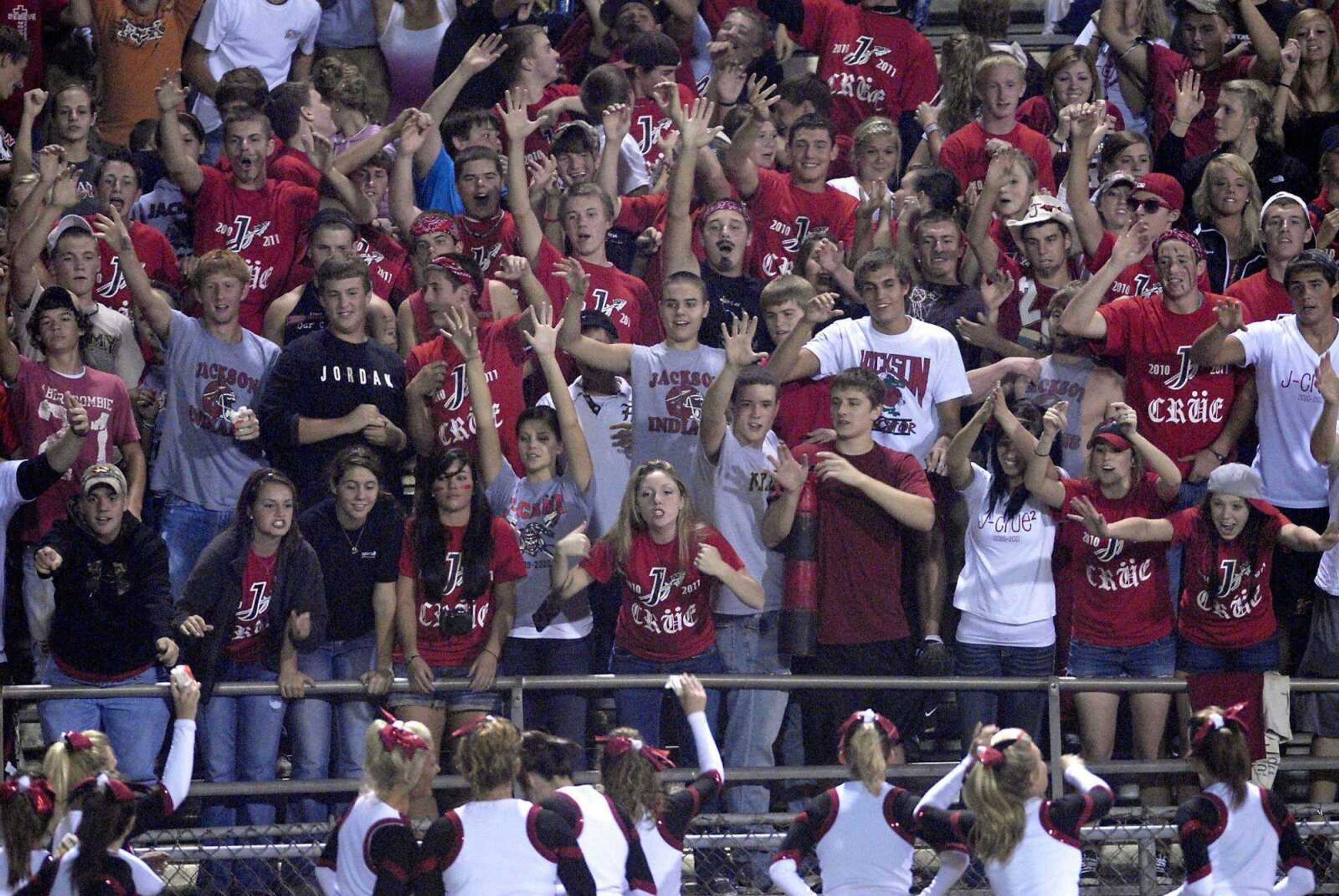 The Jackson student section interacts with the cheerleaders during the third quarter of Friday night's game in Jackson.