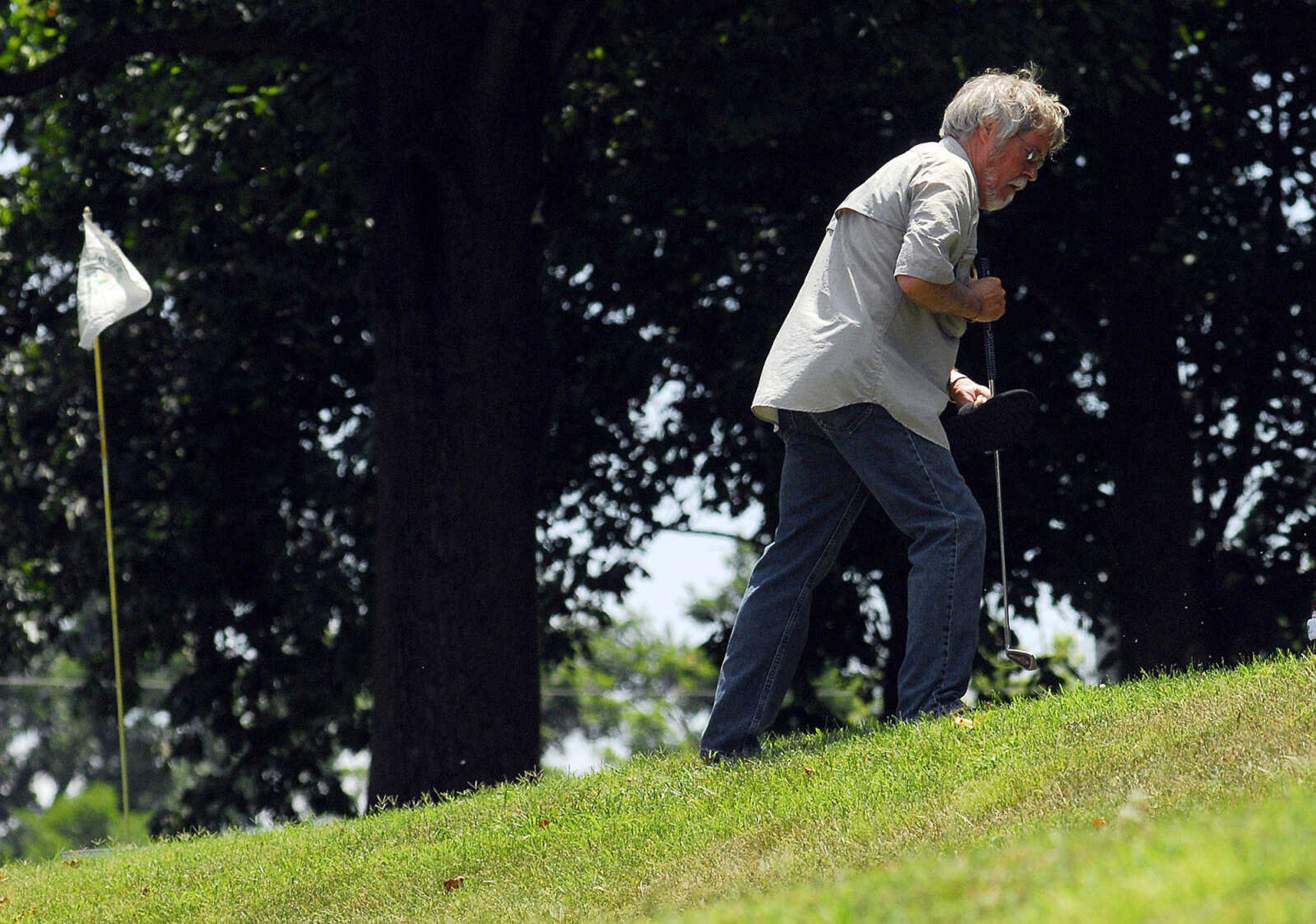 LAURA SIMON~lsimon@semissourian.com
Don Greenwood climbs the terraced hill in front of the Common Pleas Courthouse on his way to the next hole Sunday, June 27, 2010 during the First-Ever Fifth Annual Louis J. Lorimier World Famous Downtown Golf Tournament in Cape Girardeau.