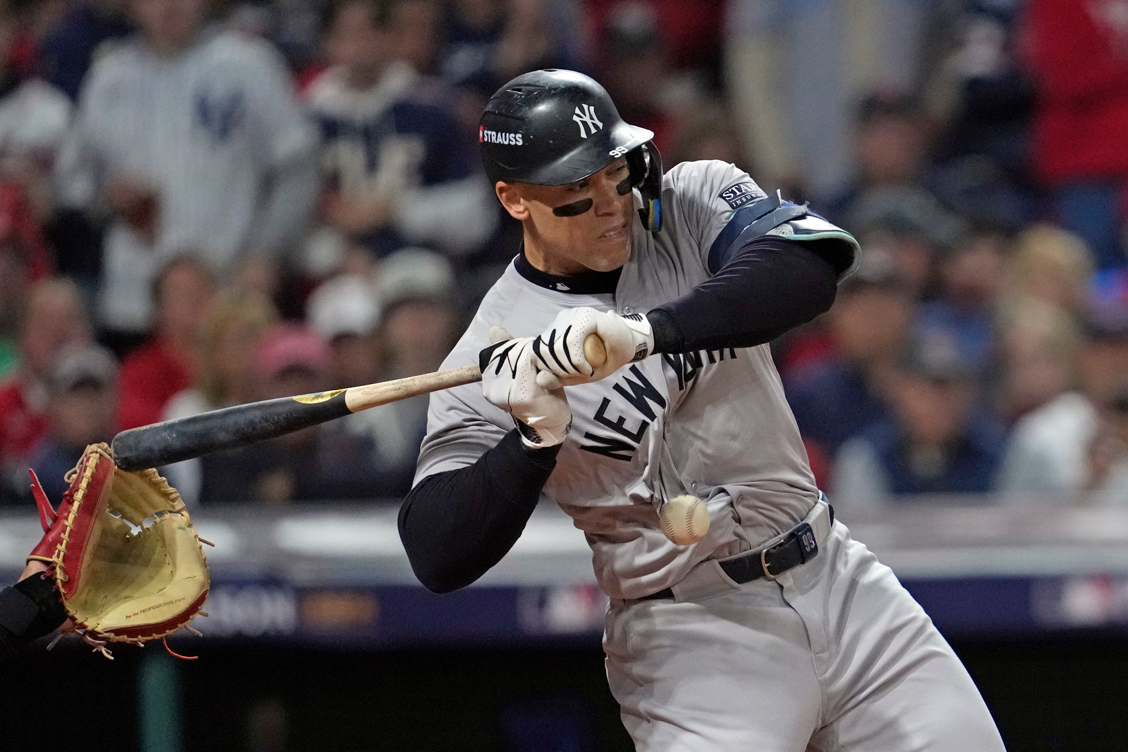 New York Yankees' Aaron Judge is hit by a pitch thrown by Cleveland Guardians starting pitcher Tanner Bibee during the first inning in Game 5 of the baseball AL Championship Series Saturday, Oct. 19, 2024, in Cleveland. (AP Photo/Godofredo A. Vásquez)