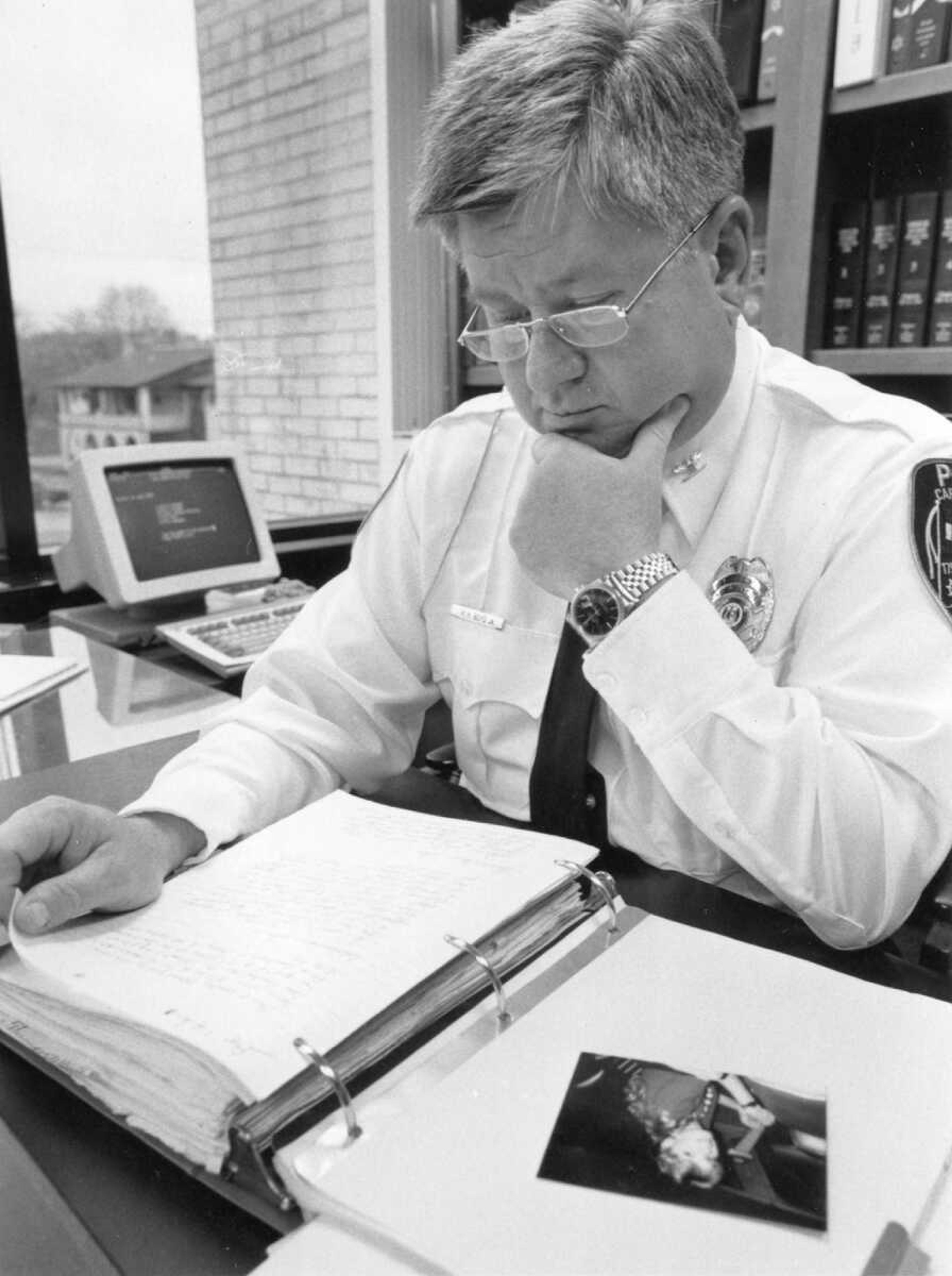 Published April 11, 1990.
Cape Girardeau Police Chief Howard Boyd looked through the file compiled over the previous two years into the disappearance of a local woman. (Southeast Missourian archive)